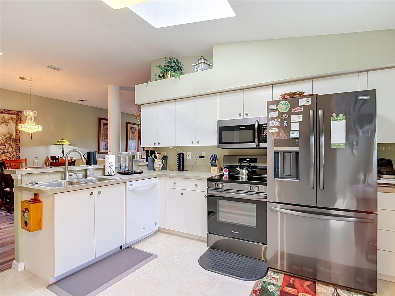 The kitchen is well lit with a skylight giving you natural lighting. Newer appliances. NOTE: the refrigerator does not convey with the property. - 13424 NORMAN CIR, HUDSON