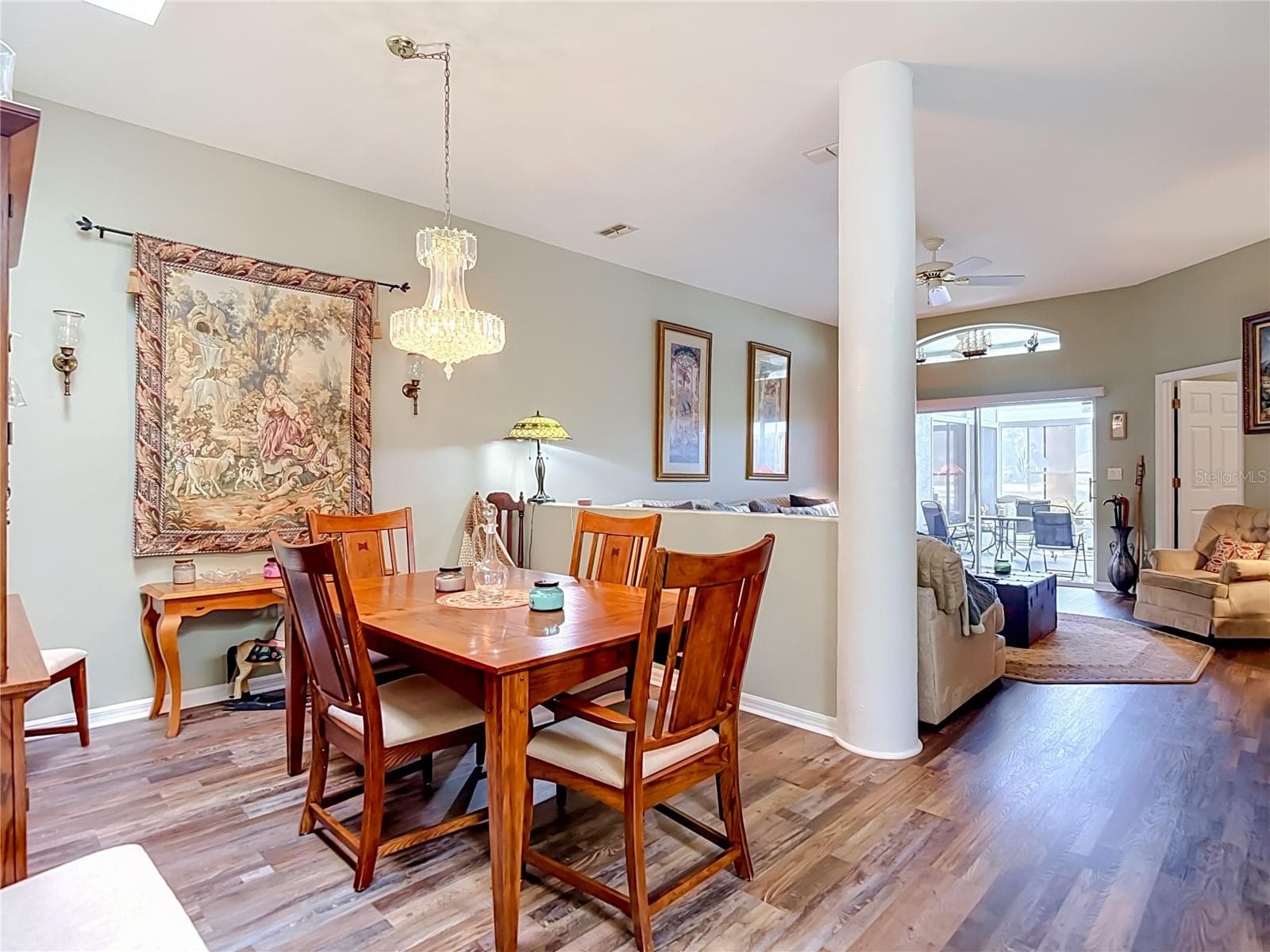 Dining area with a pillared post and divider from the living room for partial seperation of space. - 13424 NORMAN CIR, HUDSON