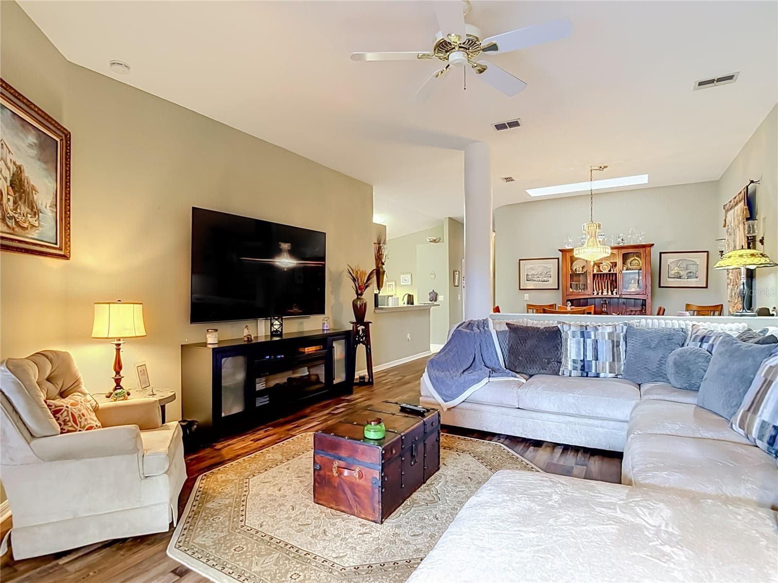 Looking from living room is the dining area and the kitchen. The high ceilings through out the home give it that big feeling. - 13424 NORMAN CIR, HUDSON