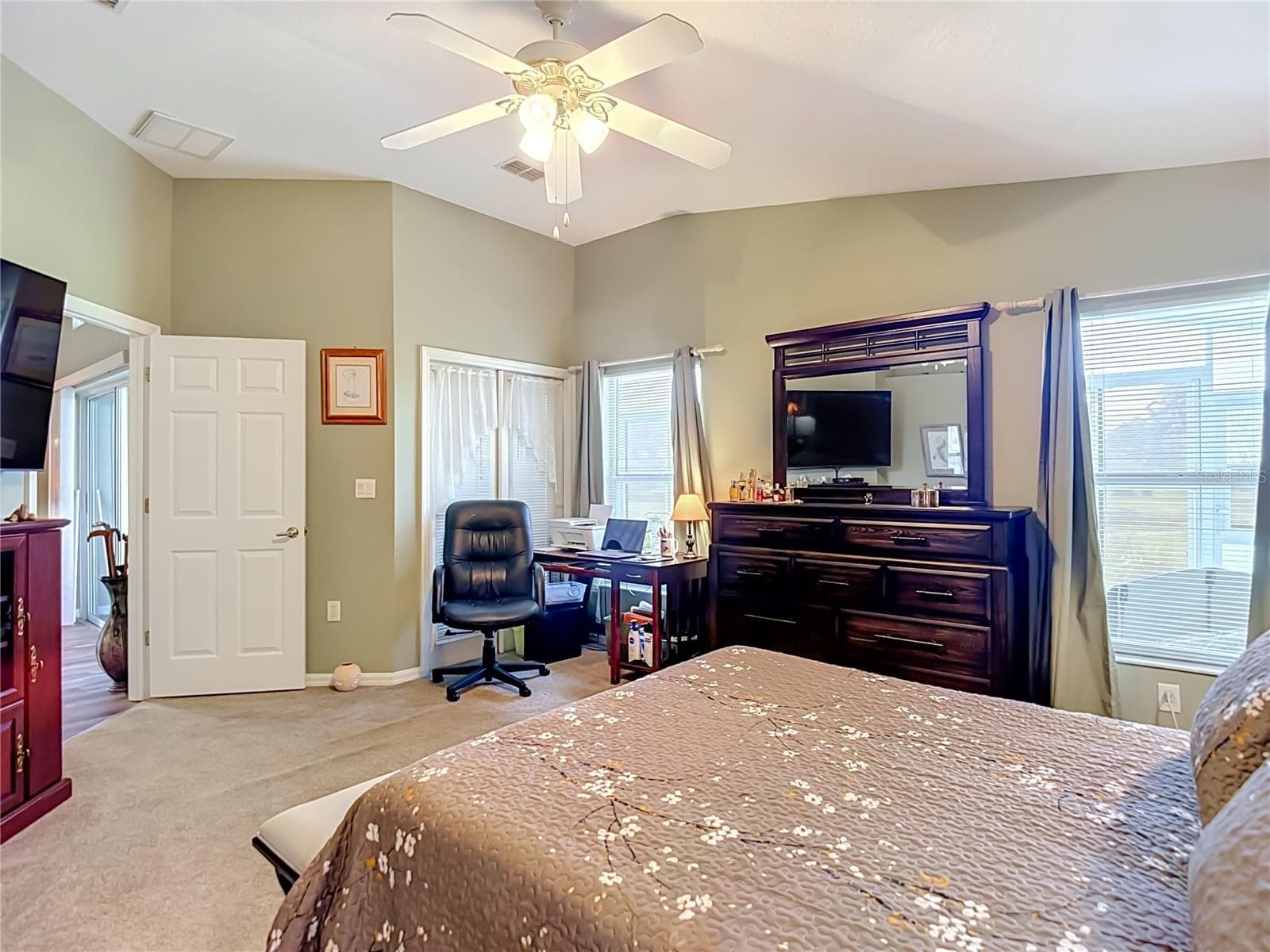 2 good sized windows and doors out to the patio again give you a lot of natural light. Room presently sitting on carpet. - 13424 NORMAN CIR, HUDSON