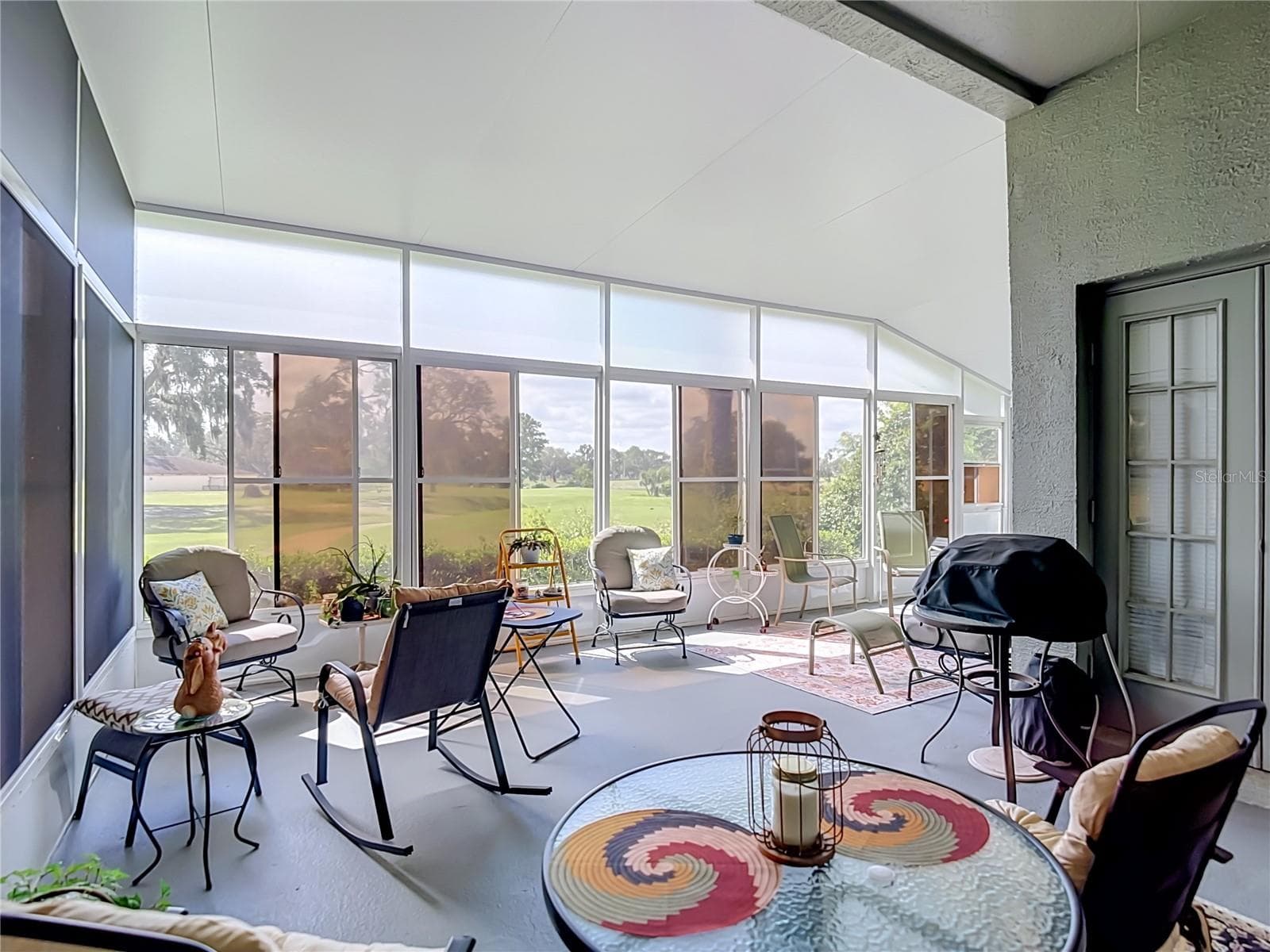 The patio is huge and gives you a view of the golf course - 13424 NORMAN CIR, HUDSON