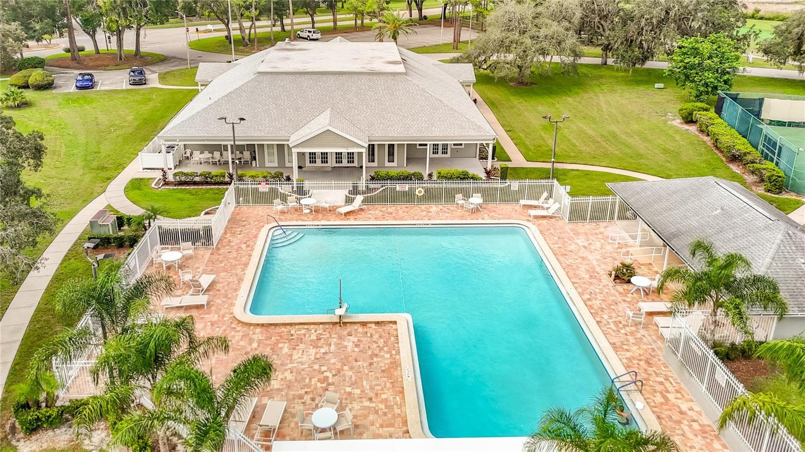 The pool area is fenced and the pool is heated. There is a cabana bthroom area with a shower as well. - 13424 NORMAN CIR, HUDSON