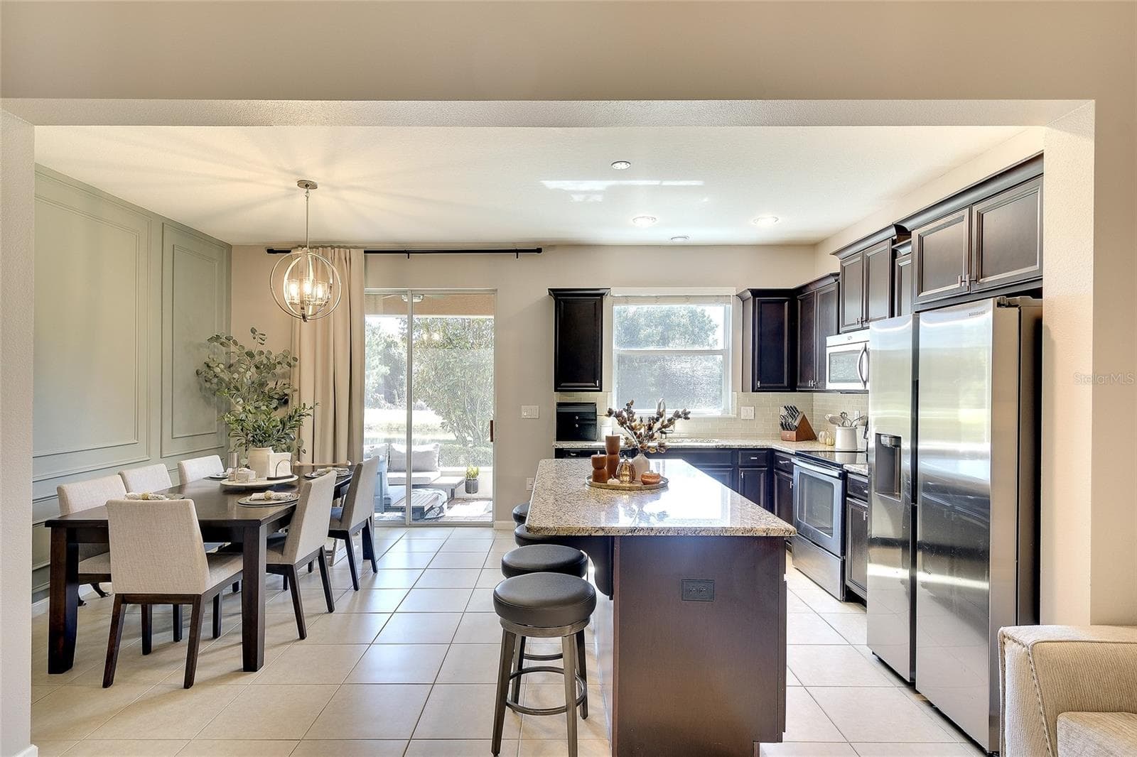 Kitchen and dining room - 12207 TRAILHEAD DR, BRADENTON