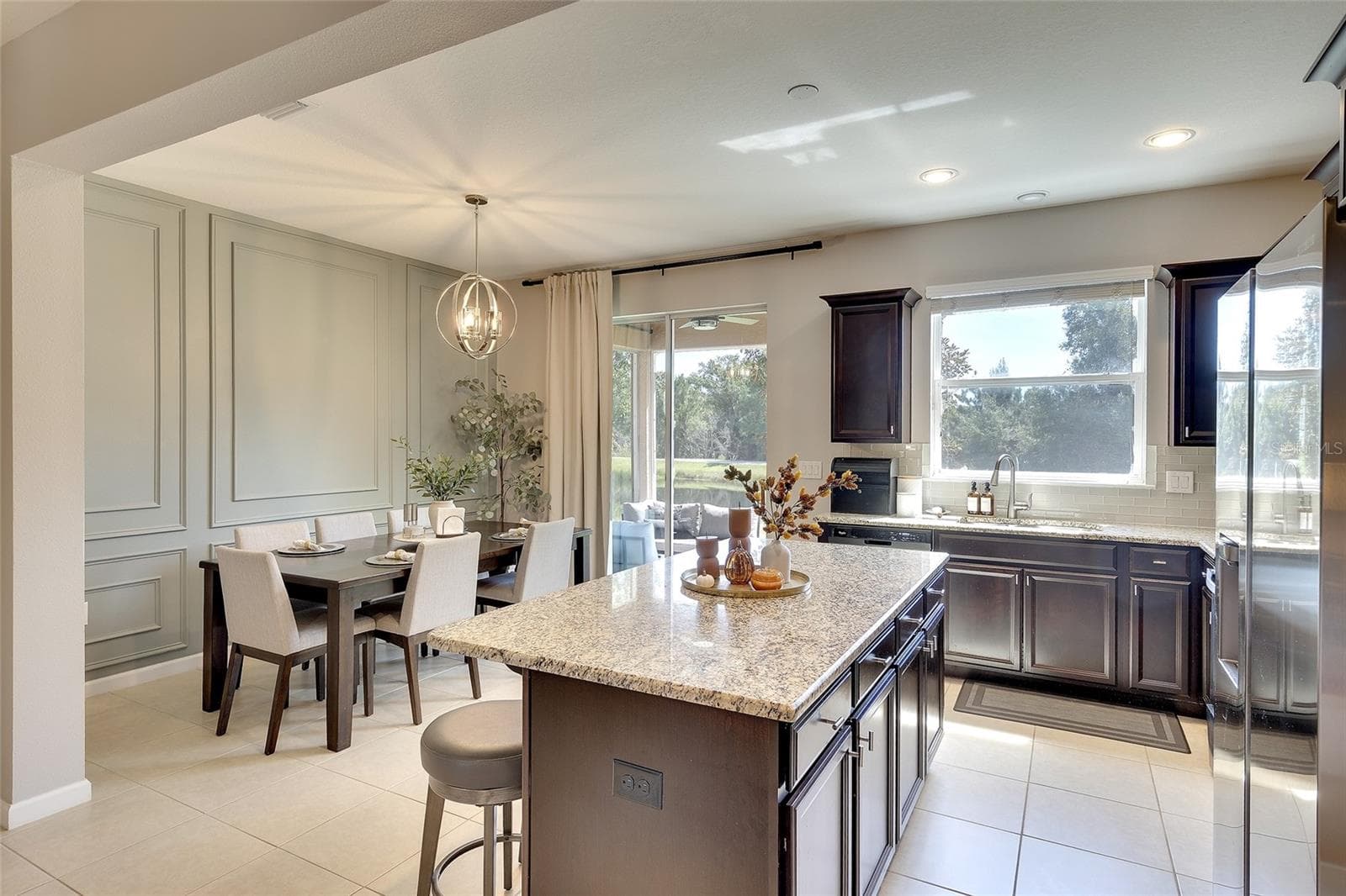 Dining area with custom accent wall - 12207 TRAILHEAD DR, BRADENTON