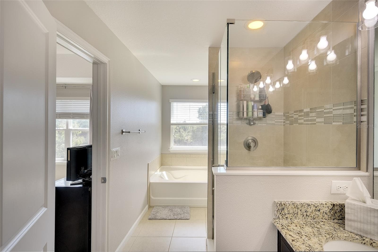 Primary bath with upgraded shower - 12207 TRAILHEAD DR, BRADENTON