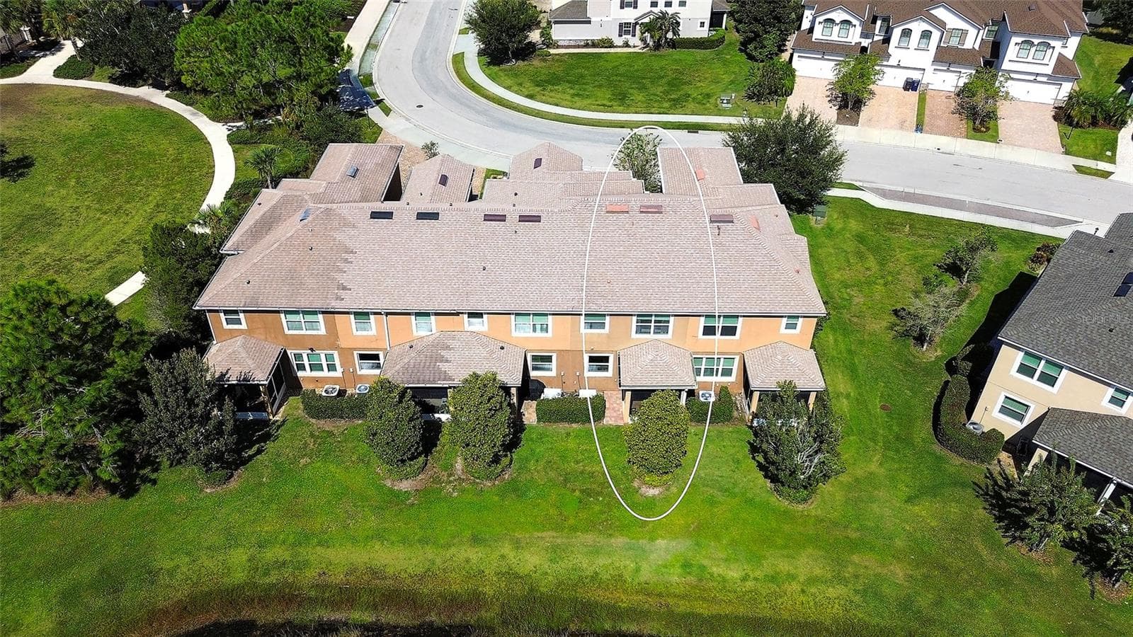Rear aerial view of the building. - 12207 TRAILHEAD DR, BRADENTON
