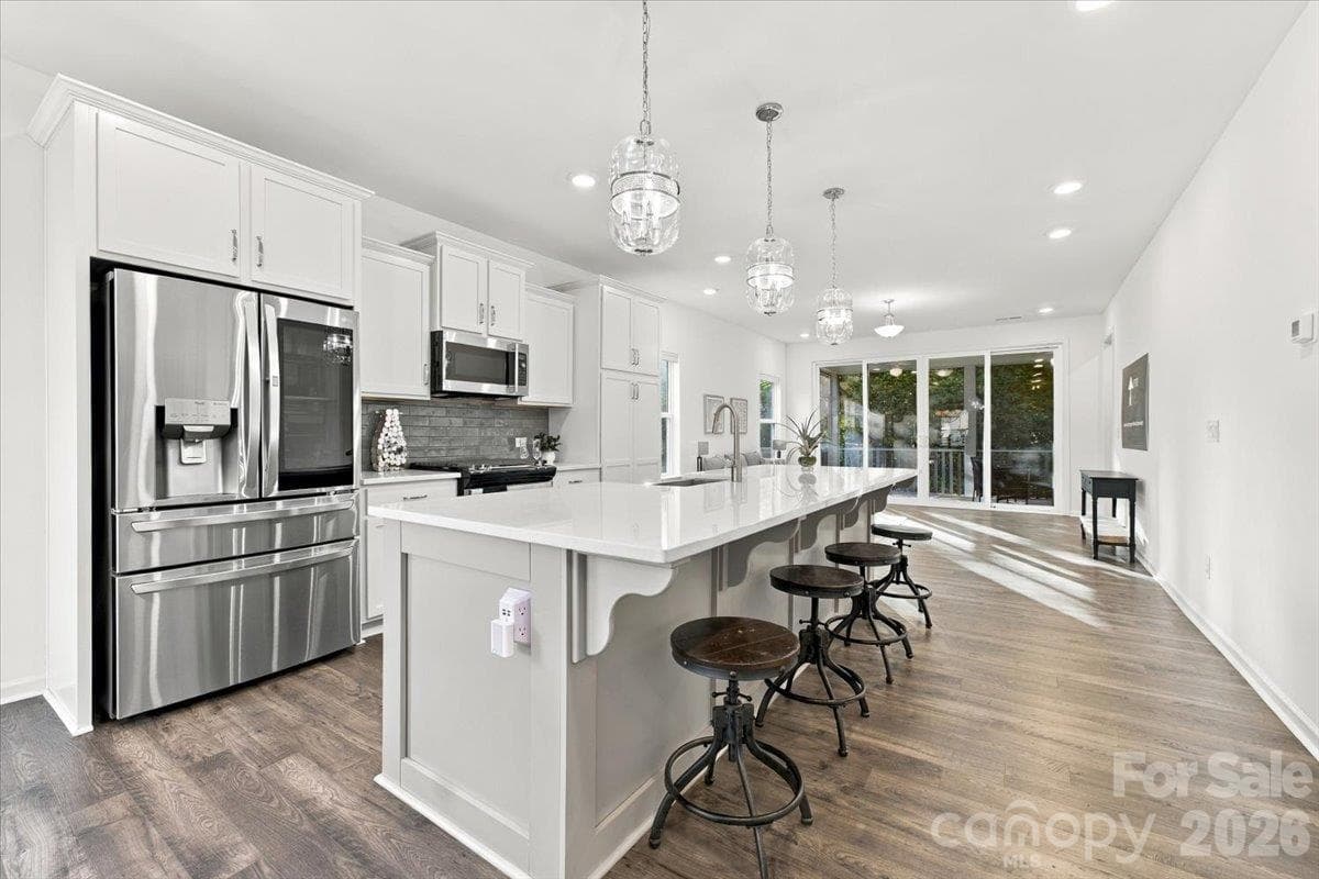 Kitchen with island seating - 24550 Blue Heron Circle, Lancaster