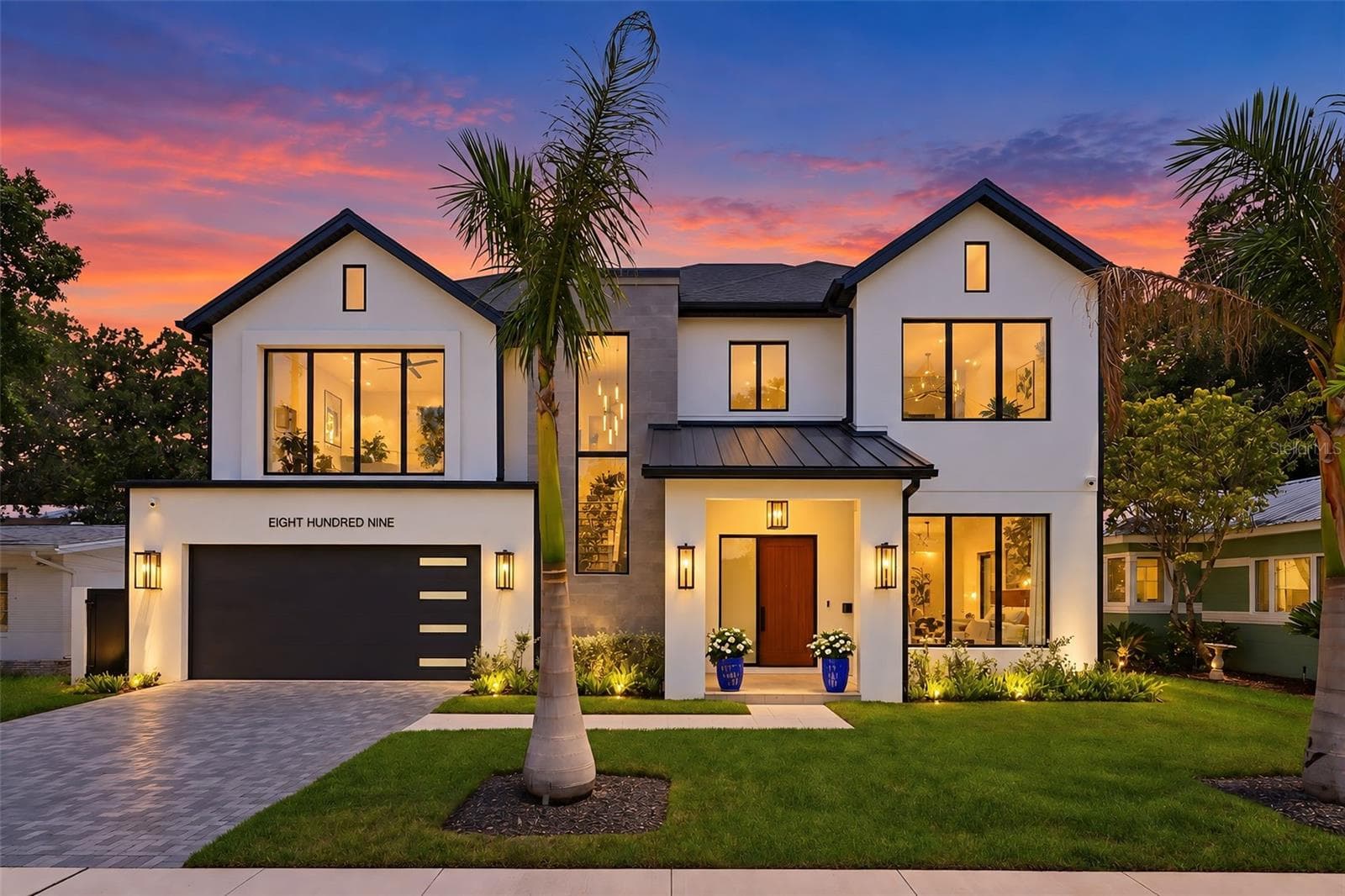 The roof combines architectural shingles with standing-seam metal accents - 809 E CHURCH ST, ORLANDO