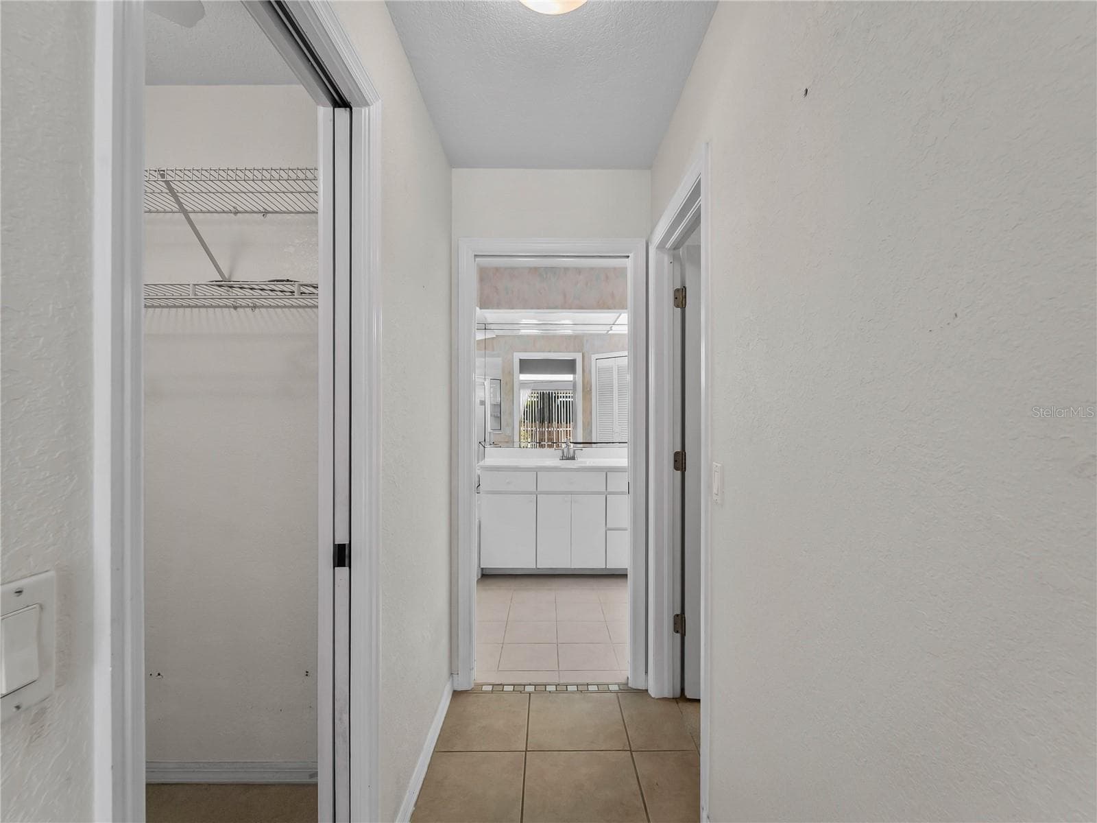 PrimarySuite_134TocopillaStreet_PuntaGorda_WalkInCloset_Entry.jpg - 134 TOCOPILLA ST, PUNTA GORDA