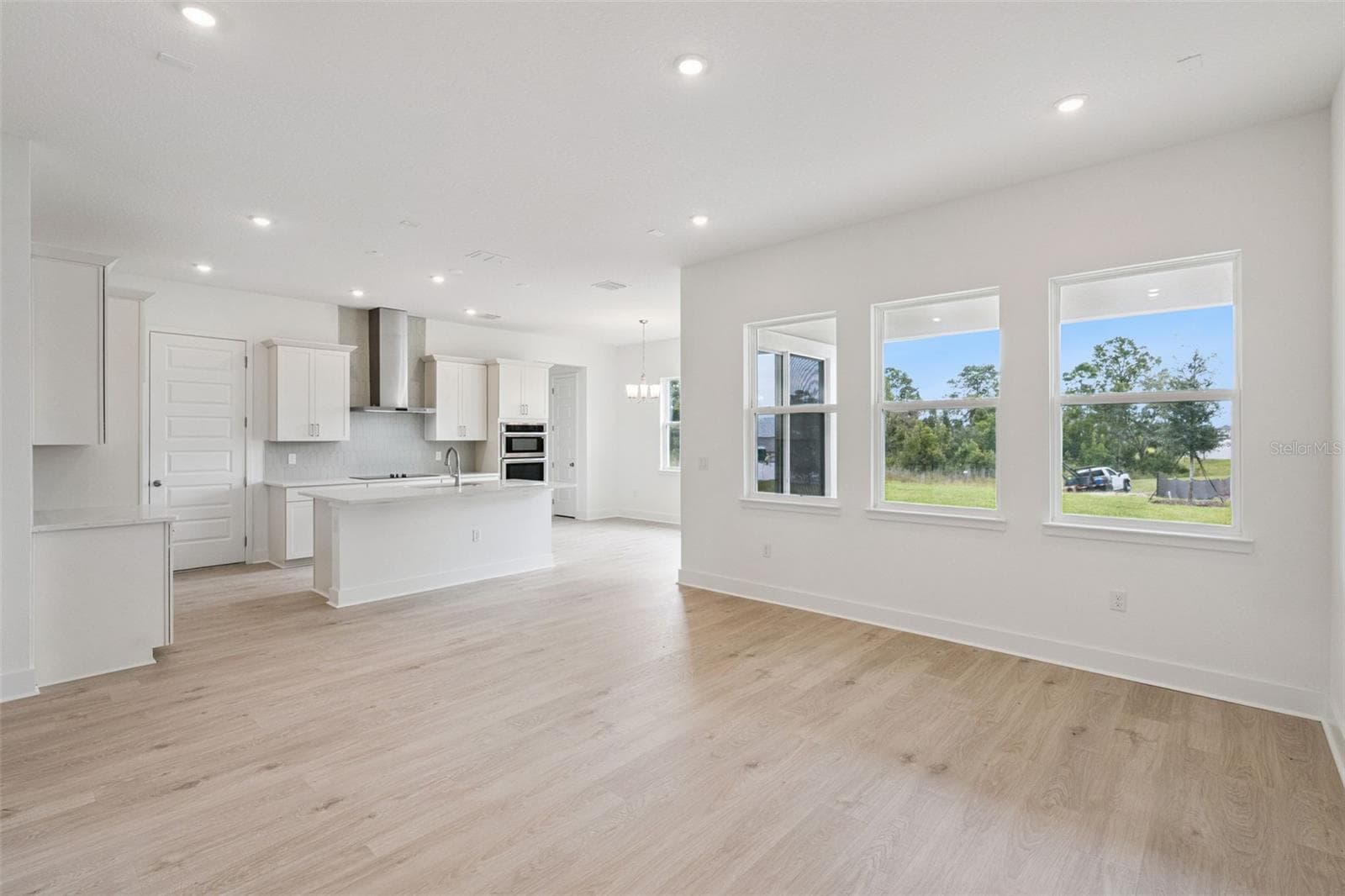 Representative photo living/kitchen - 17602 JAPONICA BLOOM DR, WINTER GARDEN