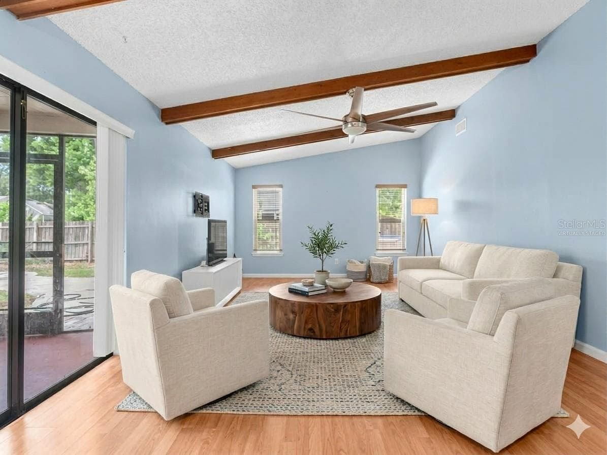 family room virtually staged - 914 HARBOR CIR, PALM HARBOR