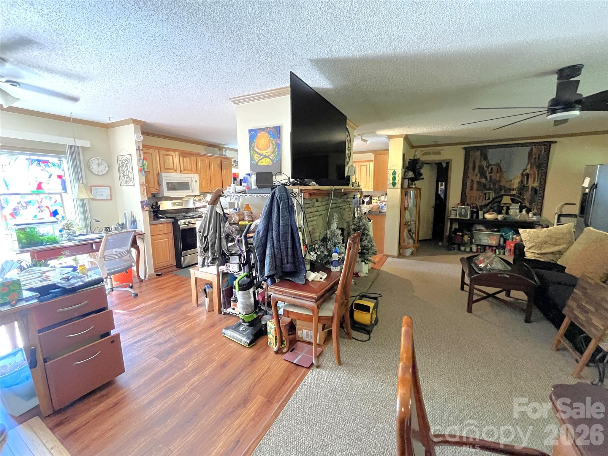 Fireplace dividing kitchen from living room - 121 Hidden Meadow Drive, Candler