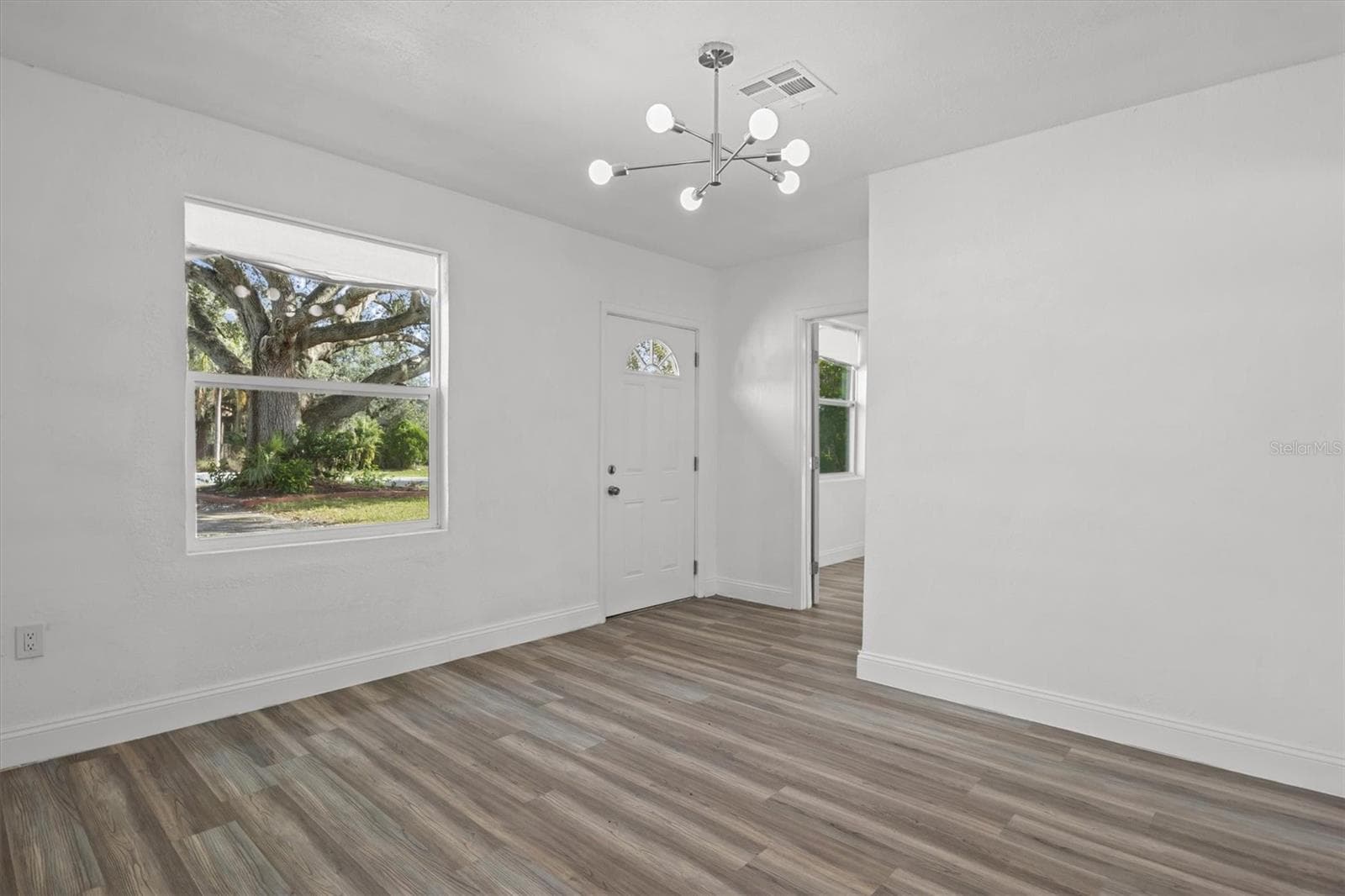 Living Room - Luxury Vinyl Flooring Throughout - 8812 OAKWOOD DR, LAKE WALES