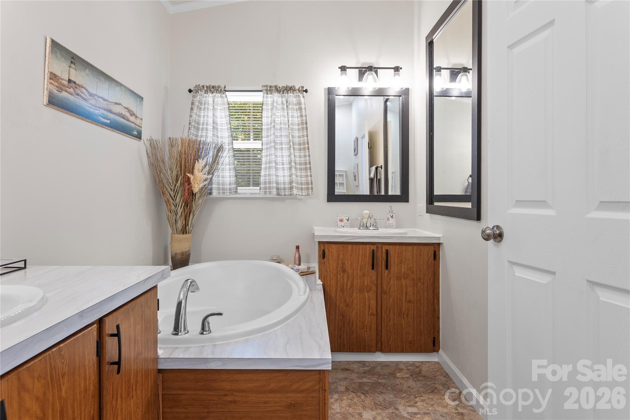 Primary bathroom with separate vanities, a soaking tub, and a separate shower. - 183 Gobbler Circle, Horse Shoe