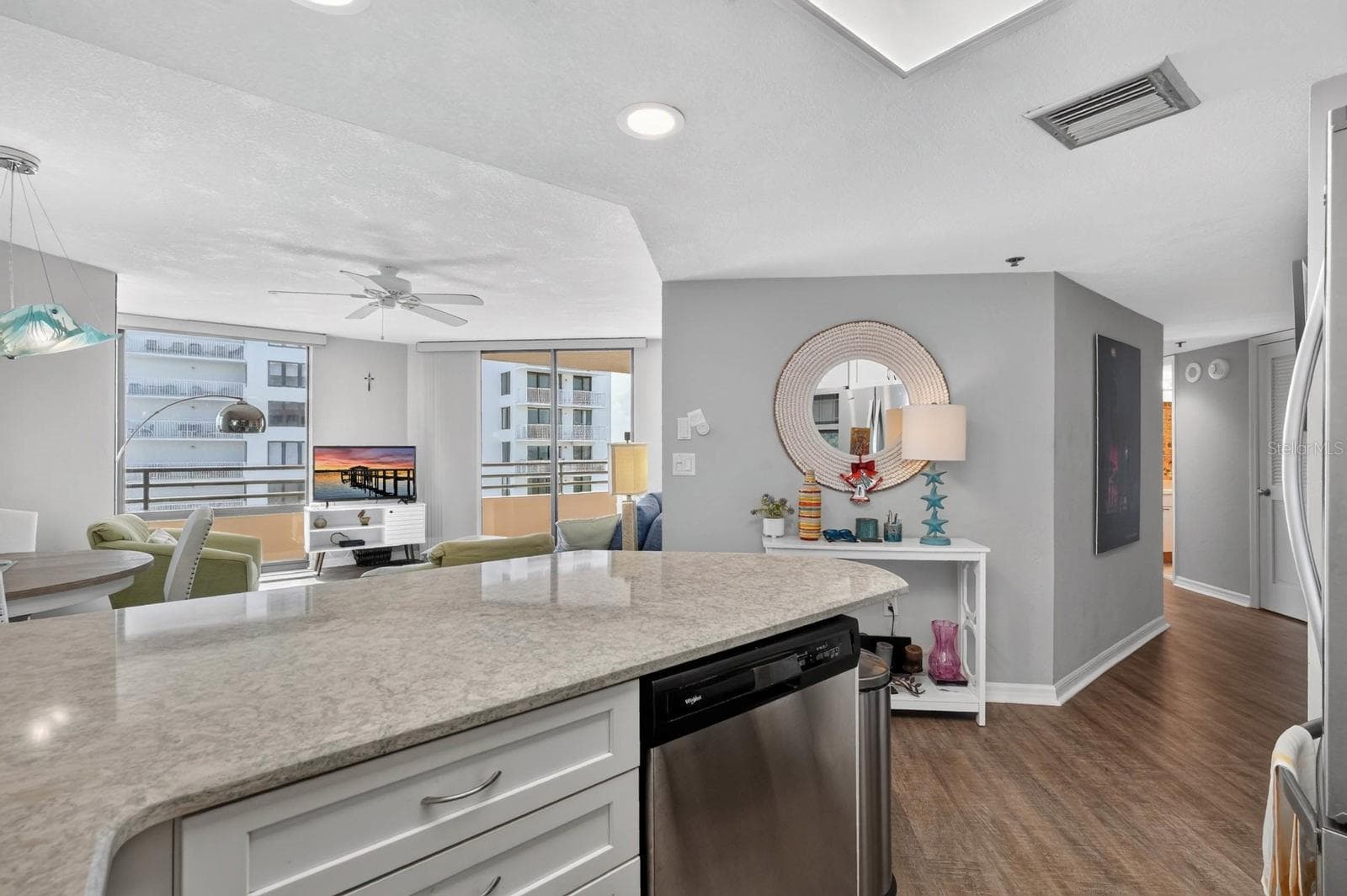 frim kitchen facing living room - 3023 S ATLANTIC AVE #1106, DAYTONA BEACH SHORES