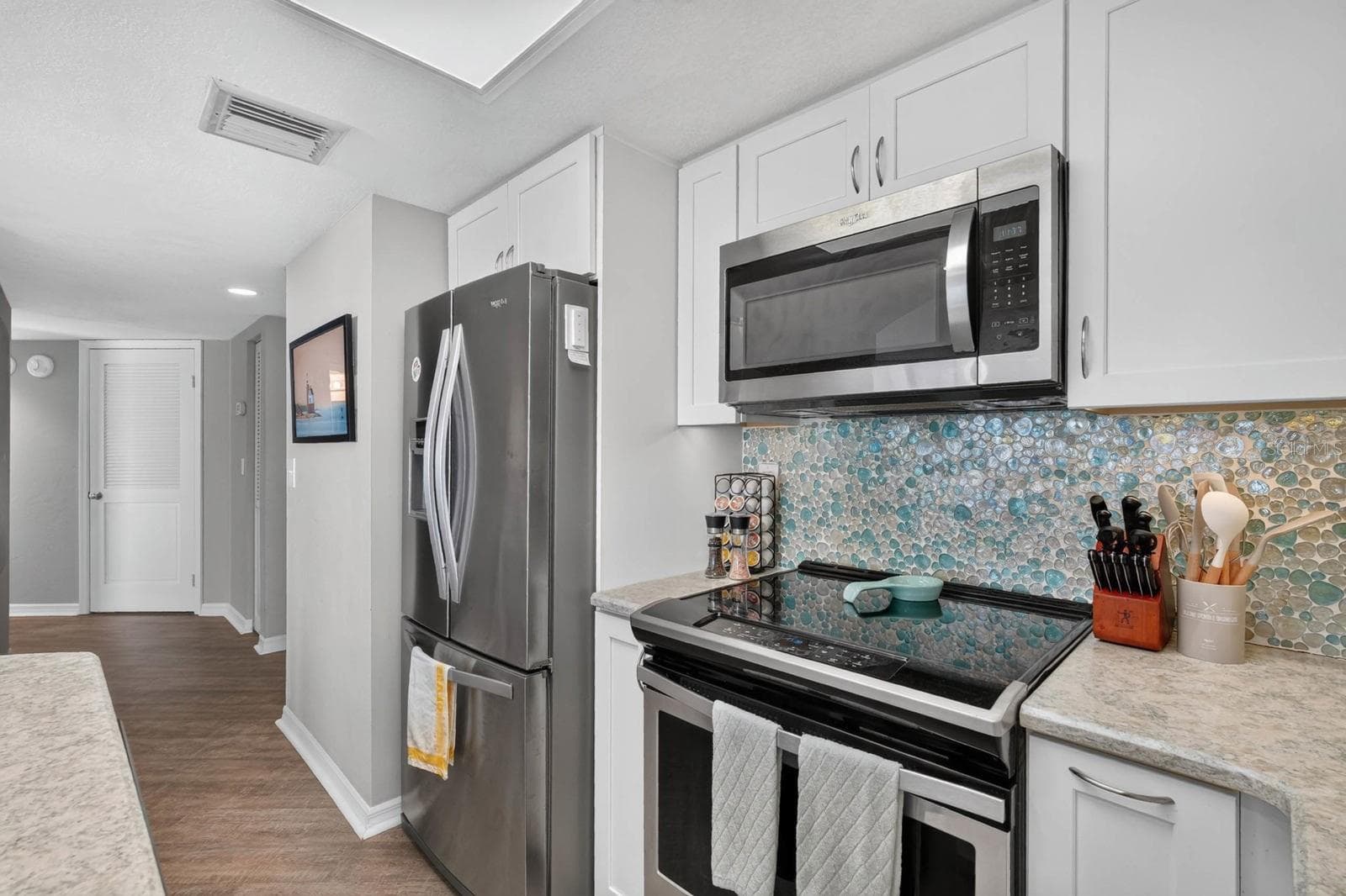 Kitchen Facing Hallway - 3023 S ATLANTIC AVE #1106, DAYTONA BEACH SHORES
