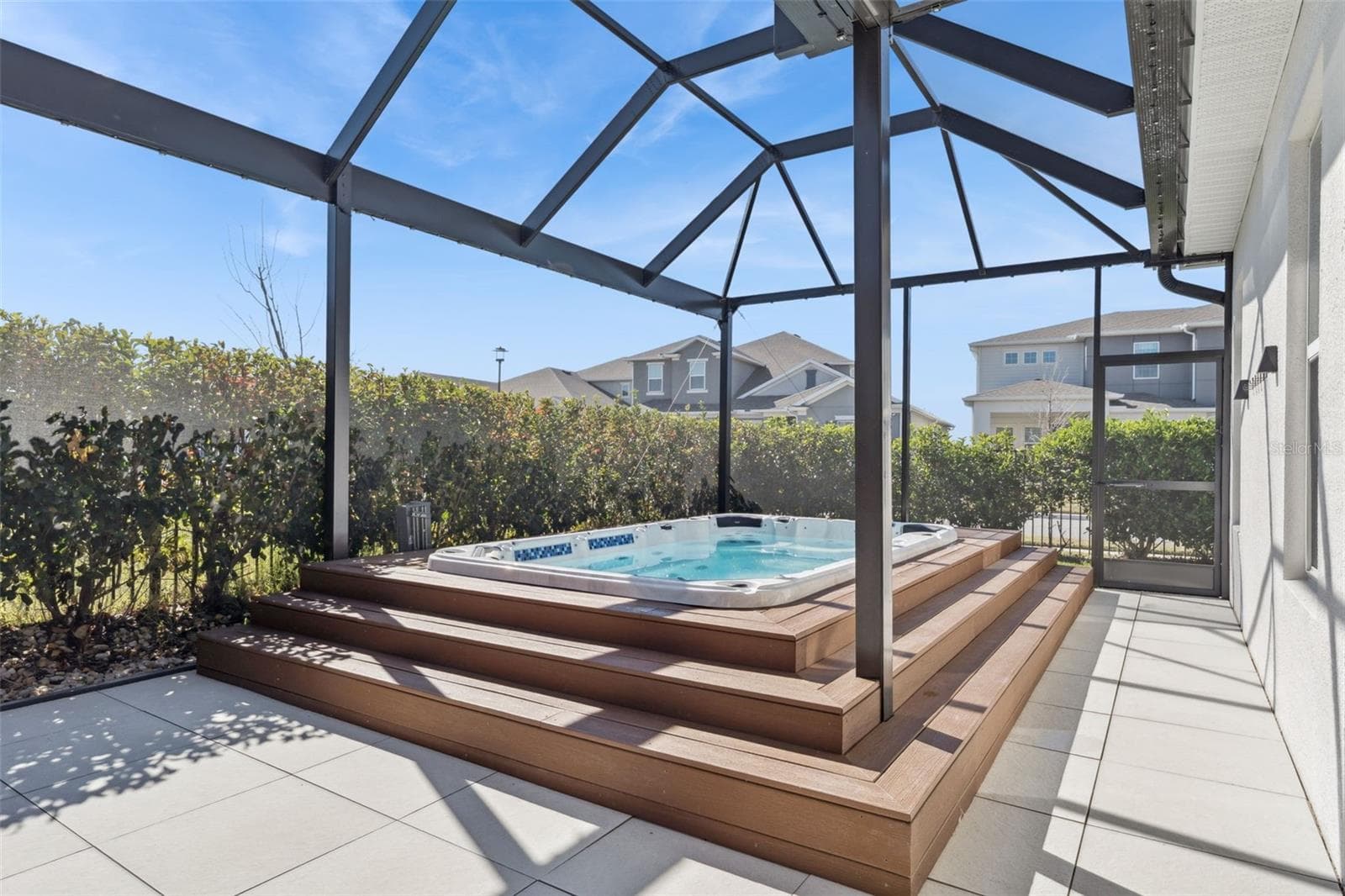 Spacious screened patio overlooking the private backyard area. - 19058 PLANETREE ST, ORLANDO