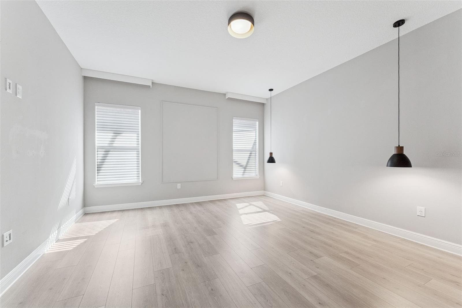 Bright primary bedroom with ample space and natural light. - 19058 PLANETREE ST, ORLANDO