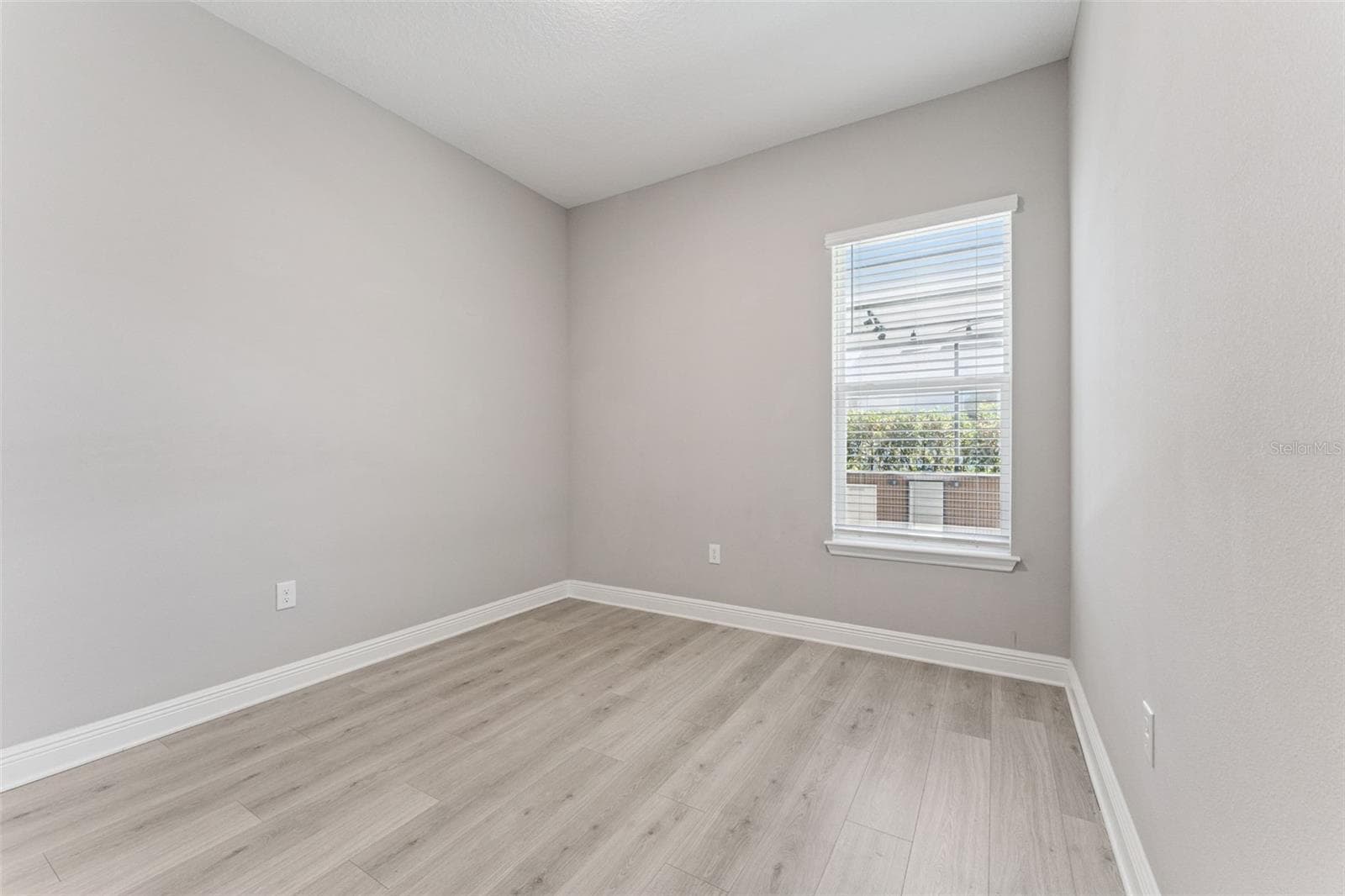 Versatile secondary bedroom with plenty of space for a home office, gym, or playroom. - 19058 PLANETREE ST, ORLANDO