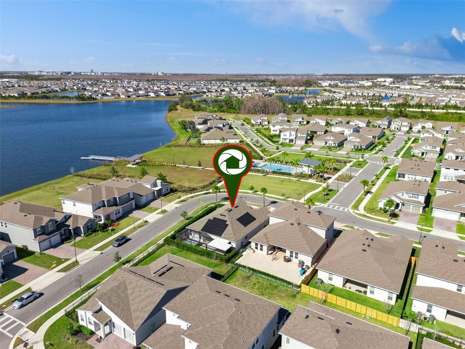 Aerial view showing the community’s scenic surroundings and nearby water views. - 19058 PLANETREE ST, ORLANDO