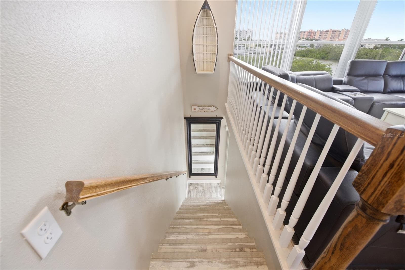 Stairs leading down to the additional bedrooms, bonus space, and more! - 6244 SPOONBILL DR, NEW PORT RICHEY
