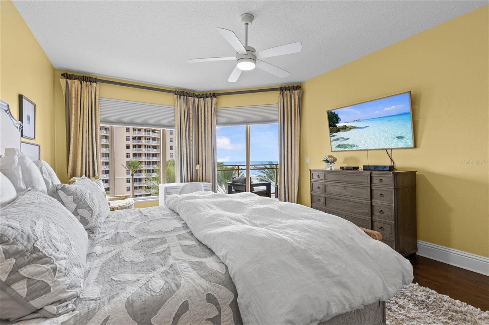 Peaceful primary suite with Gulf views and sliders opening to the private balcony. - 11 BAYMONT ST #703, CLEARWATER