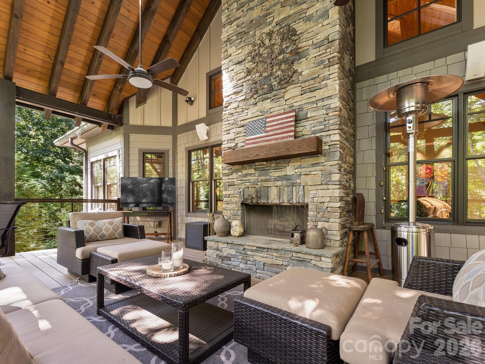 Floor to ceiling stacked stone wood burning fireplace adds a sense of cozy on those cool days - 359 New Castle Road, Brevard