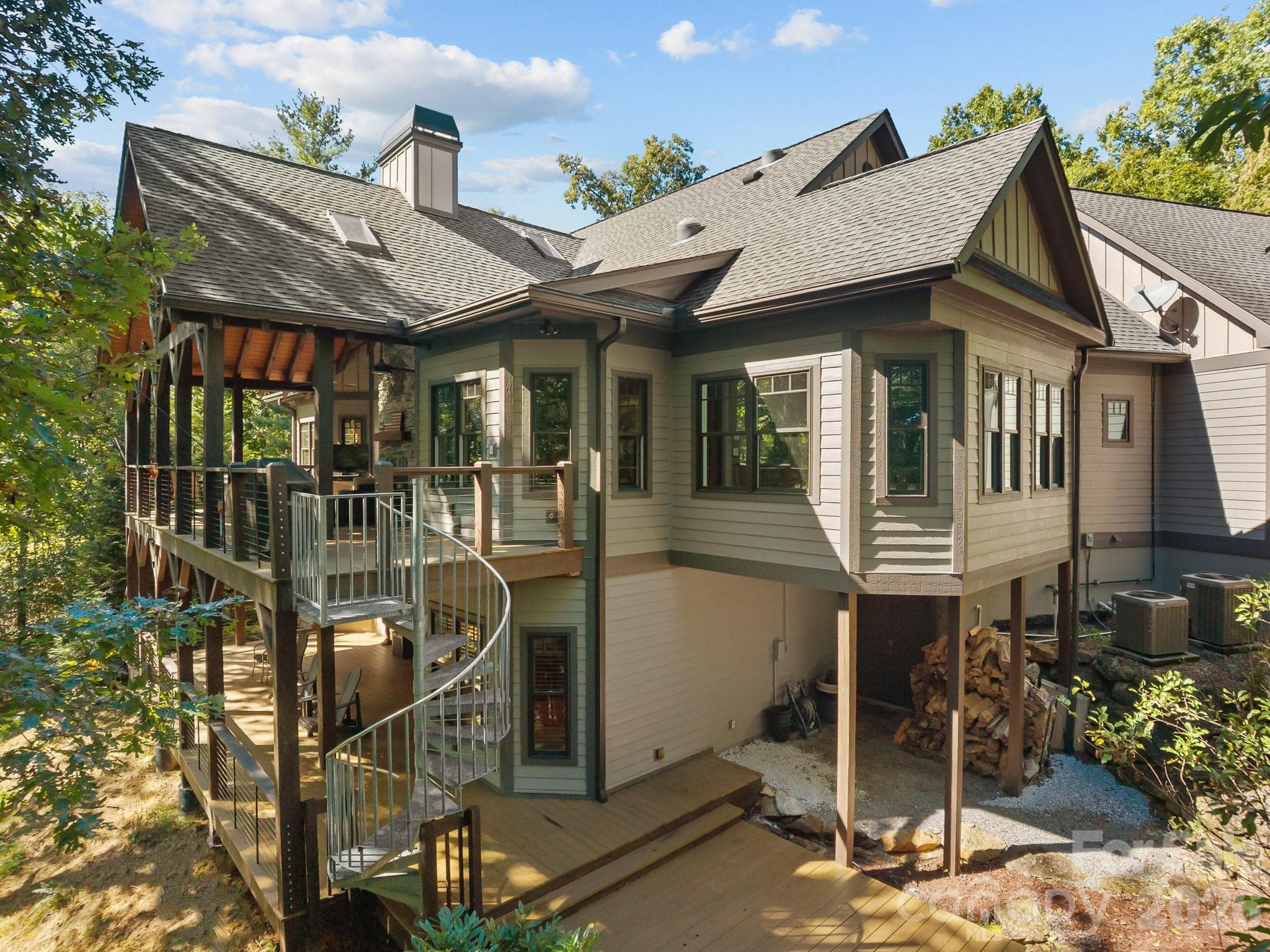 Plenty of lower level outdoor decking really gives you the ability to be in nature while only being 10 minutes to town - 359 New Castle Road, Brevard