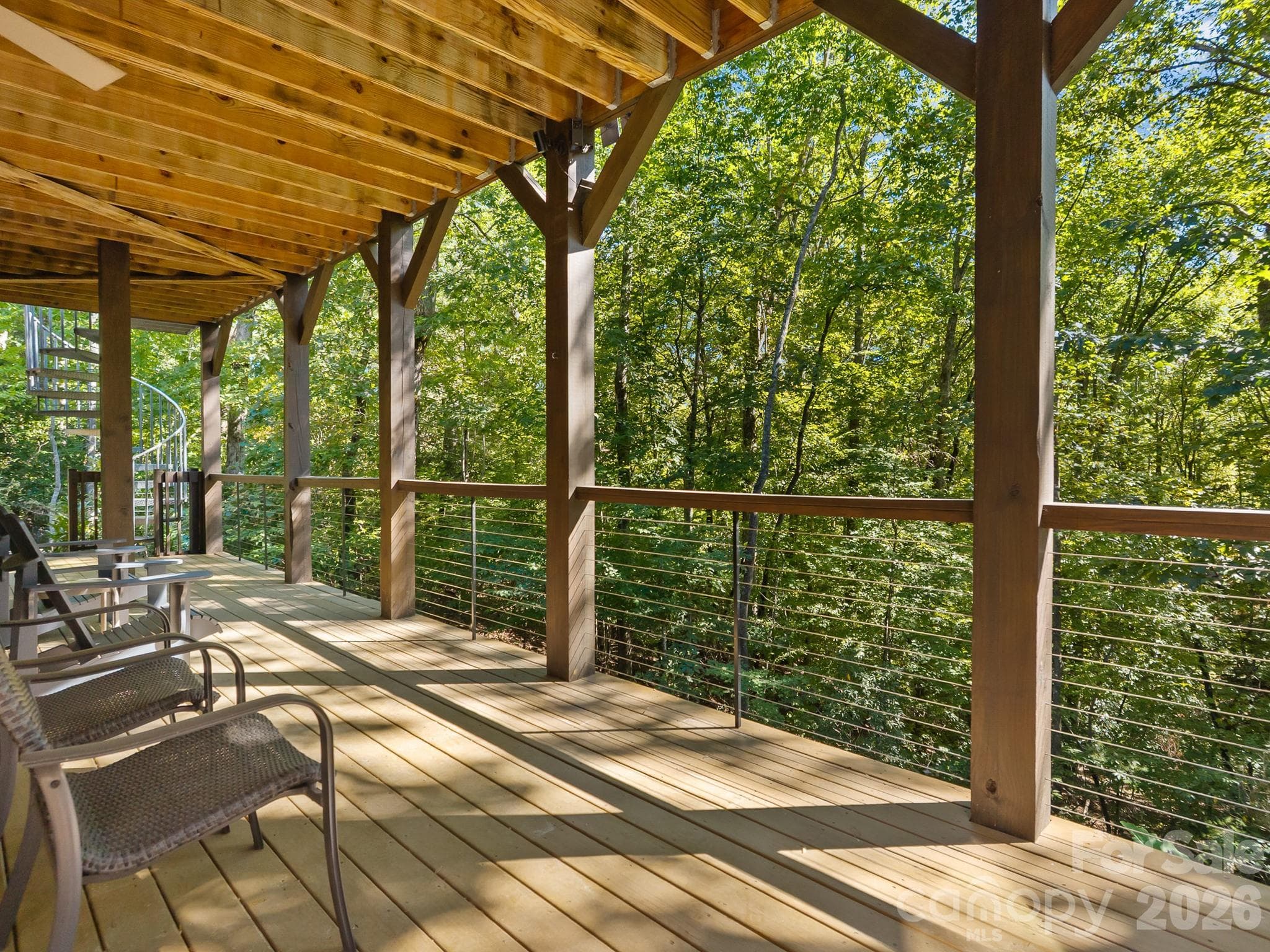 Part of the lower level decking is covered from the porch above - 359 New Castle Road, Brevard