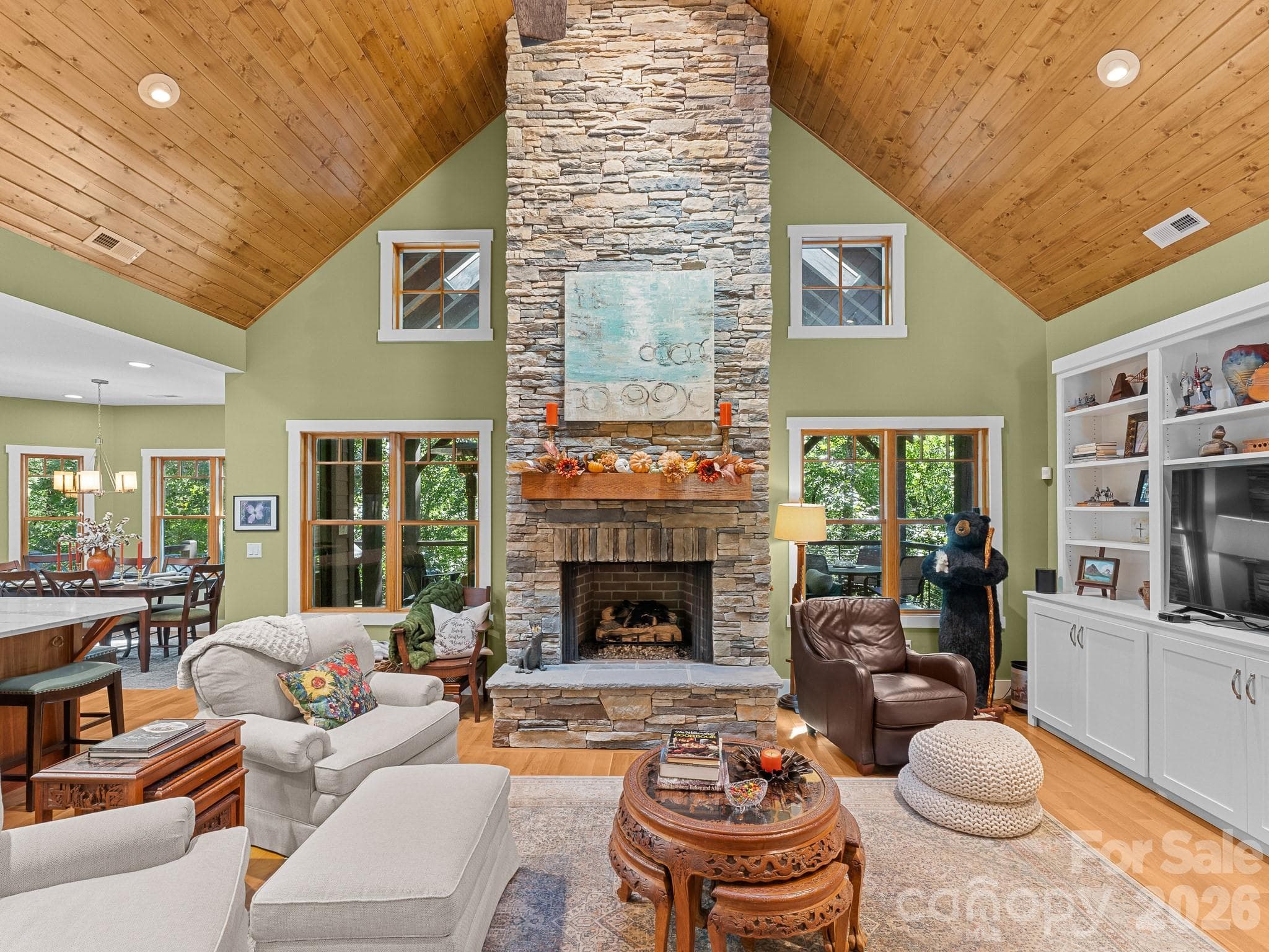 Main gathering space around a stacked stone gas fireplace easy cozy and warm. - 359 New Castle Road, Brevard