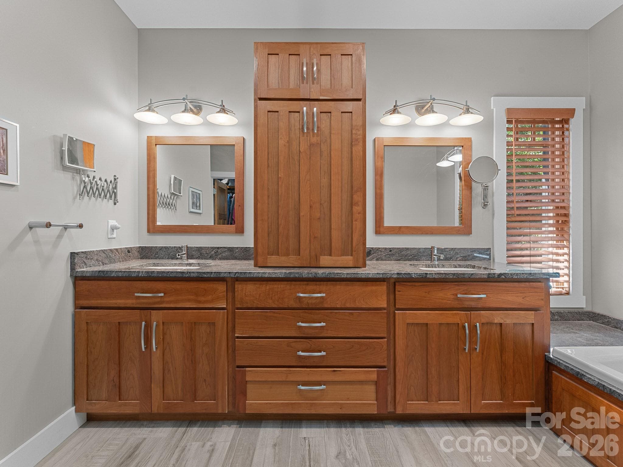Primary bath with ample cabinetry for storage - 359 New Castle Road, Brevard