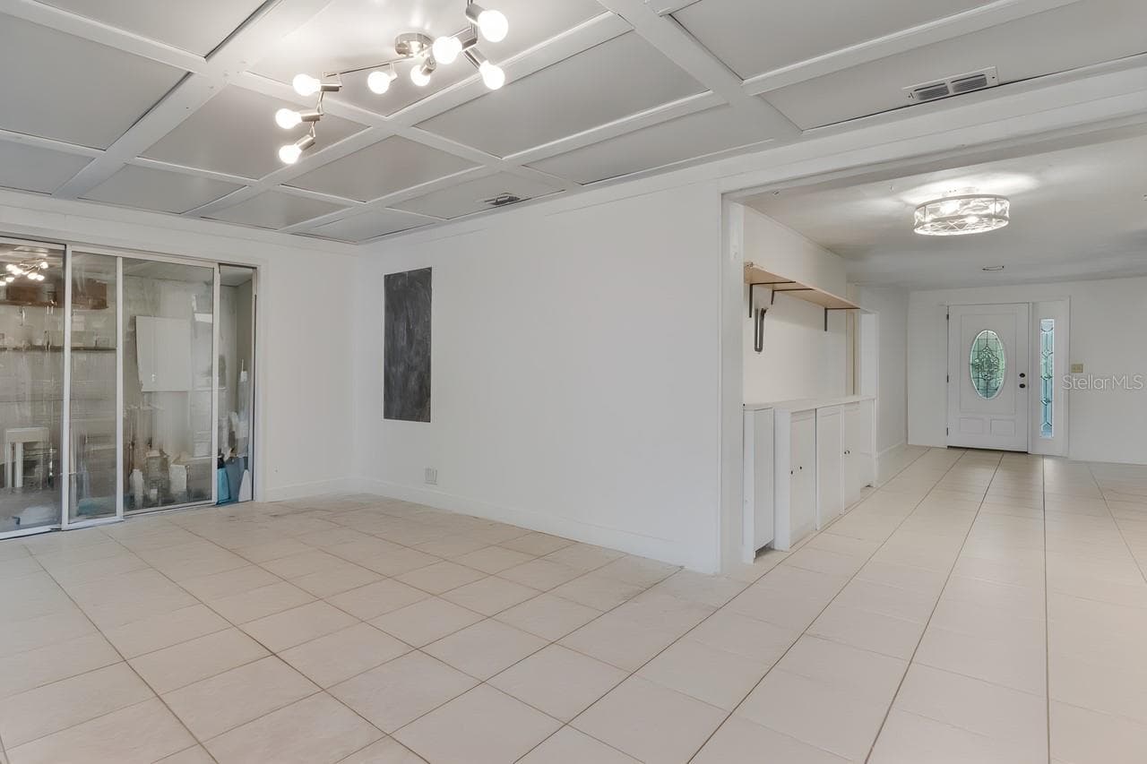 Dining and family room w/out furniture and art supplies - 11005 HARDING DR, PORT RICHEY
