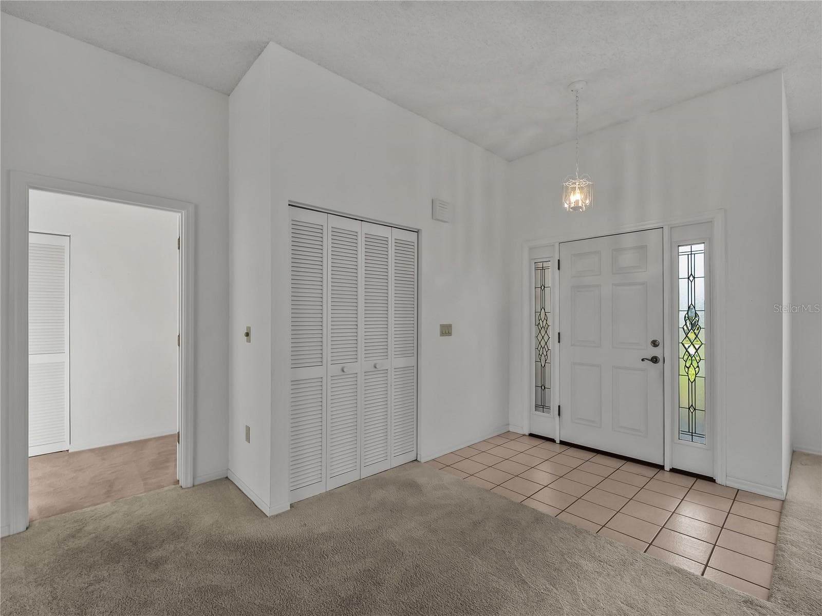 Front door and Hall closet - 5121 PALM AIRE DR, SARASOTA