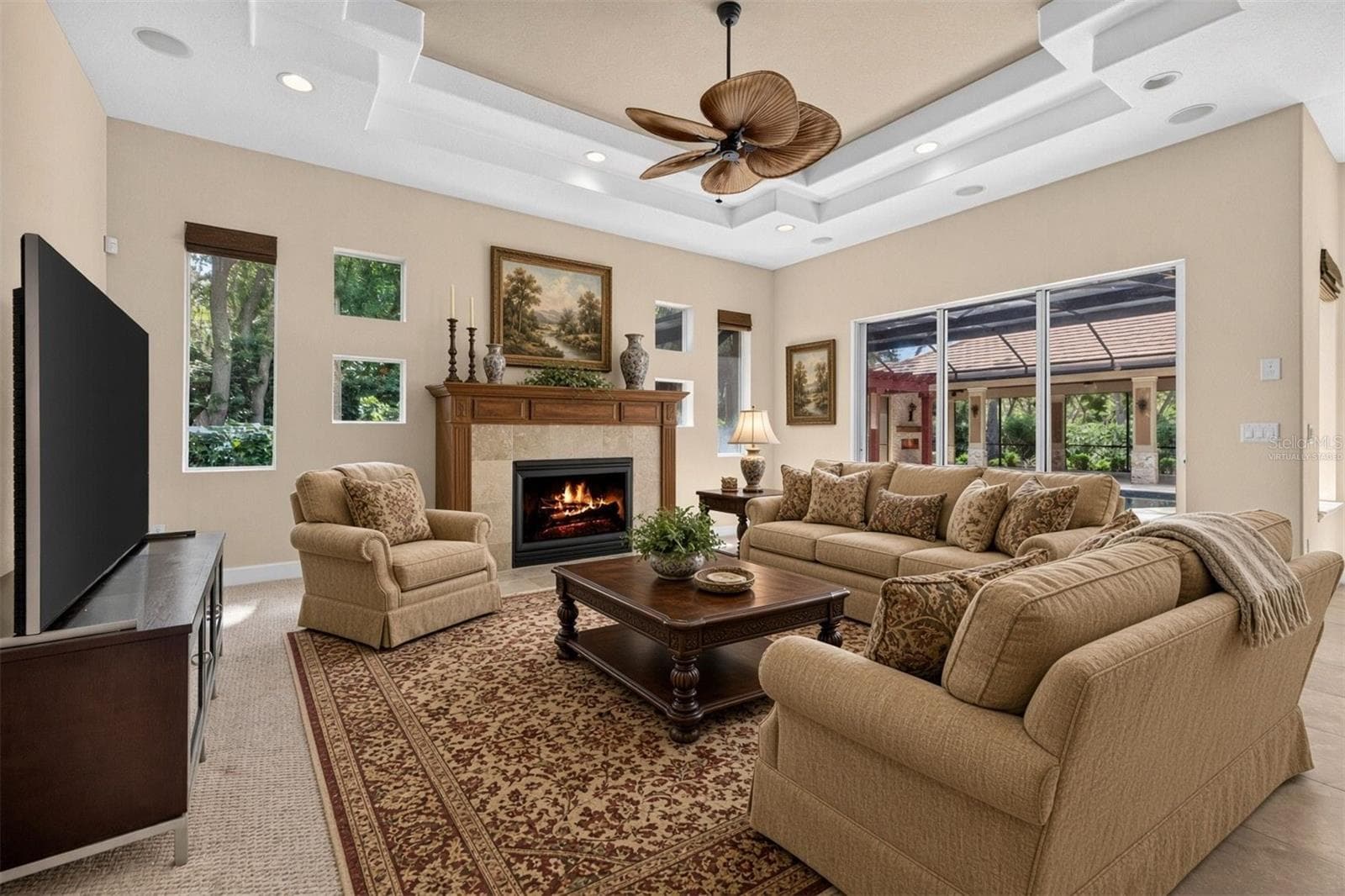 Virtually staged family room option 1 - 1516 CANOPY OAKS BLVD, PALM HARBOR