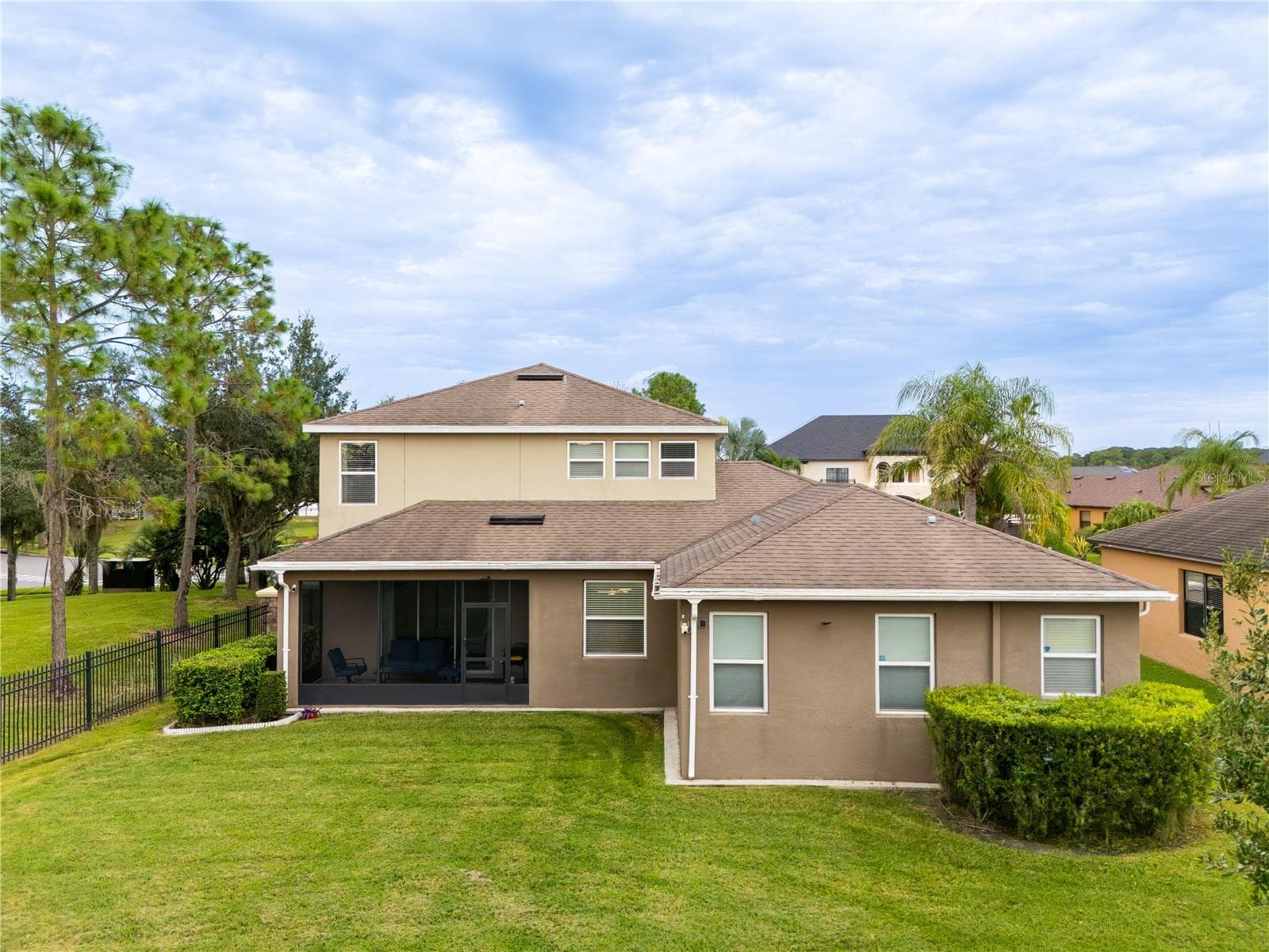 Rear exterior with screened lanai on a 0.21-acre lot - 3048 BOATING BLVD, KISSIMMEE