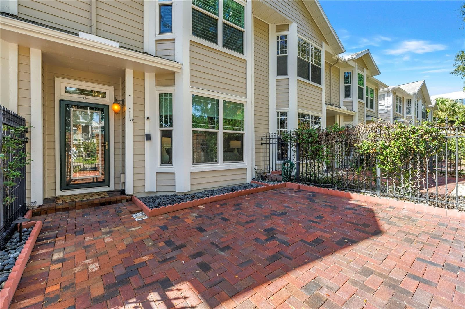 Private brick courtyard creates a welcoming outdoor entry and an added sense of privacy in the heart of downtown. - 350 2ND ST N #6, ST PETERSBURG