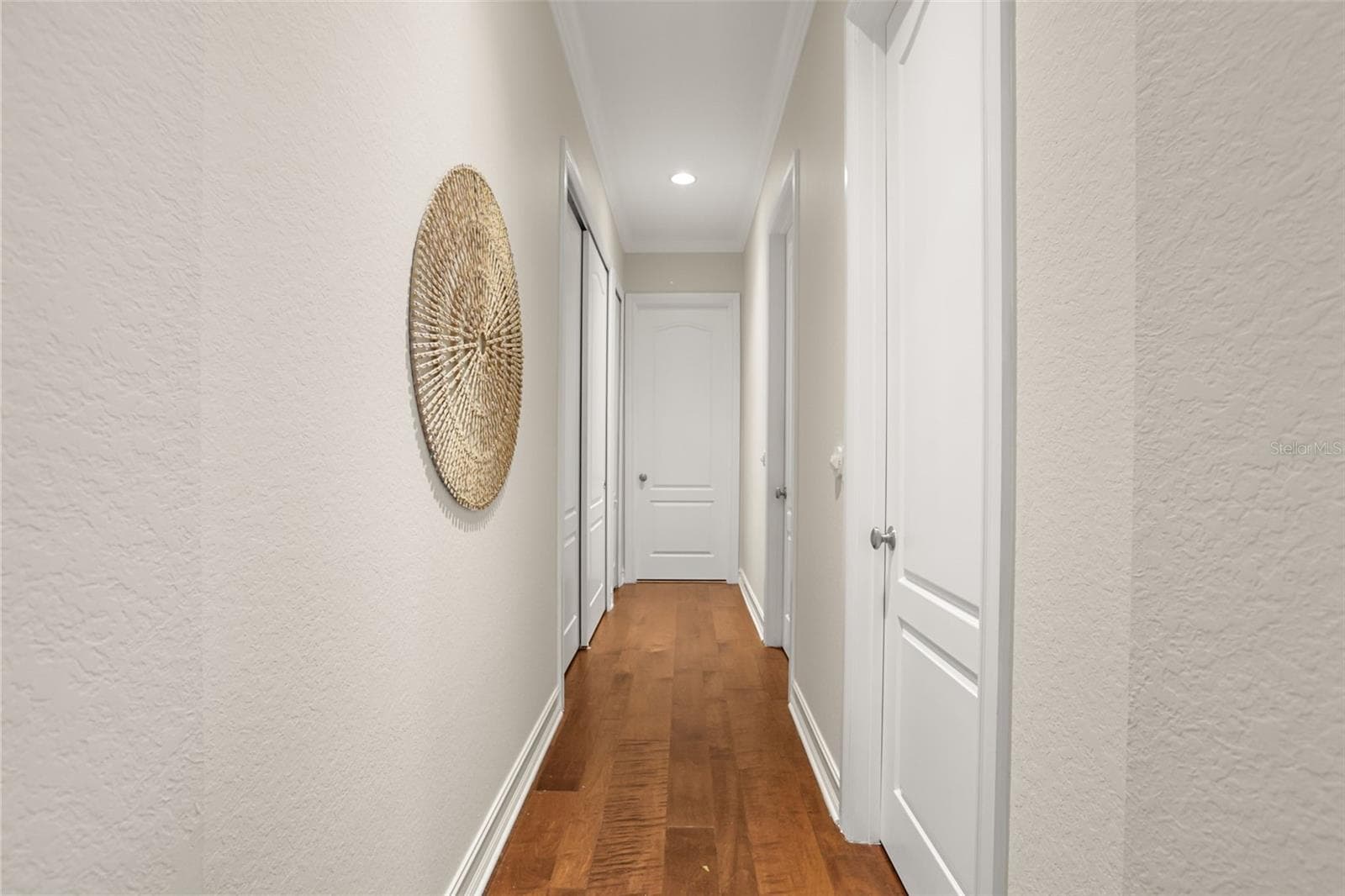 Downstairs Primary has 2 walk in closets on the right, 1 full size clothes closet on the left and an additional linen closet on the left, leading to the bathroom - 1260 BELLA VISTA CIR, LONGWOOD