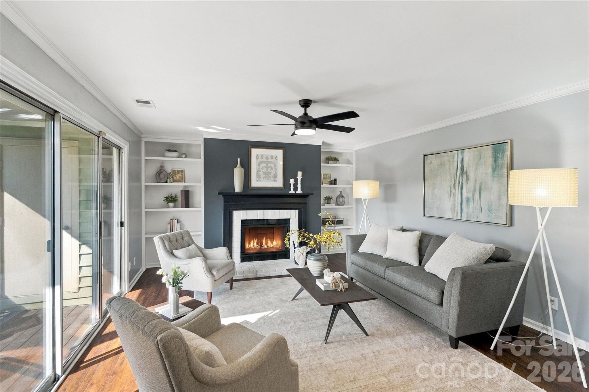 Wood-burning fireplace framed by built-in shelving - 762 Marsh Road, Charlotte