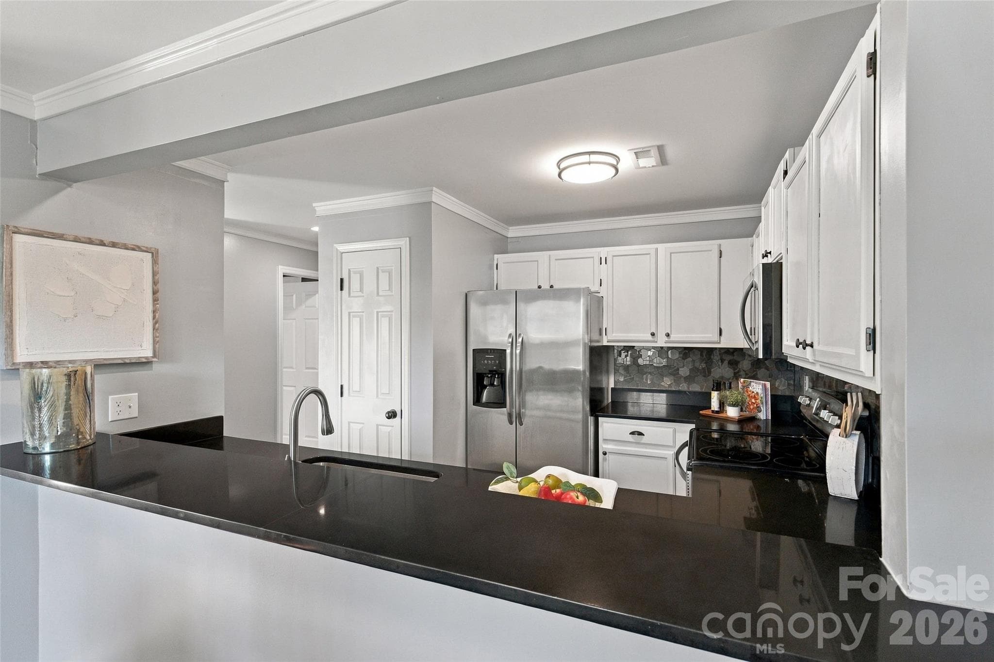 Breakfast bar provides additional counter space - 762 Marsh Road, Charlotte