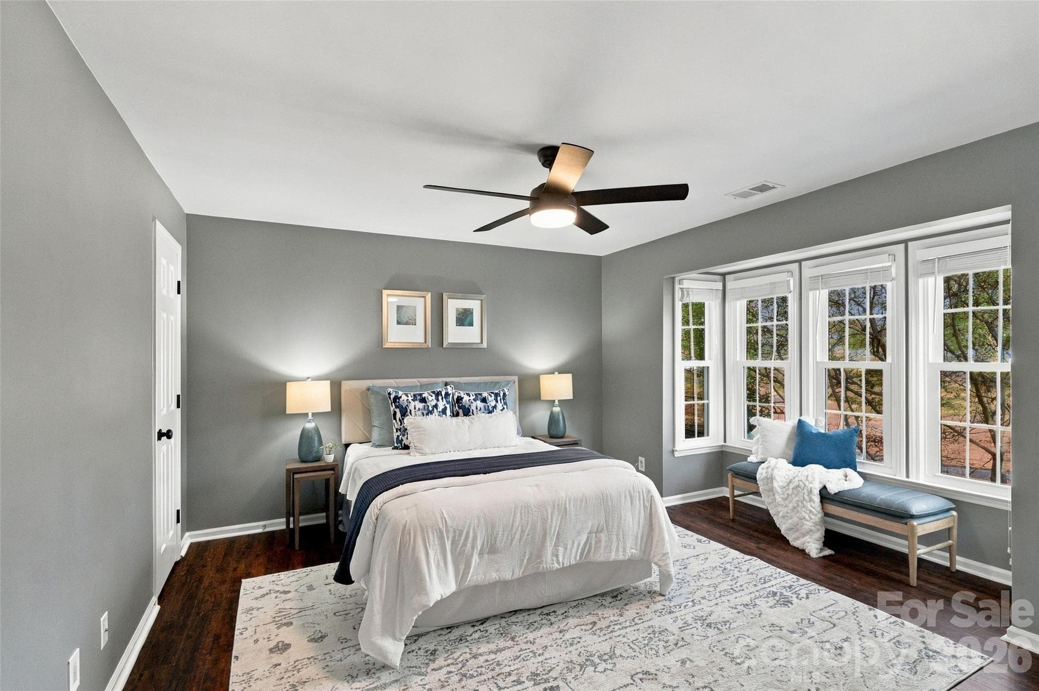 Spacious primary bedroom with ceiling fan and abundant natural light - 762 Marsh Road, Charlotte