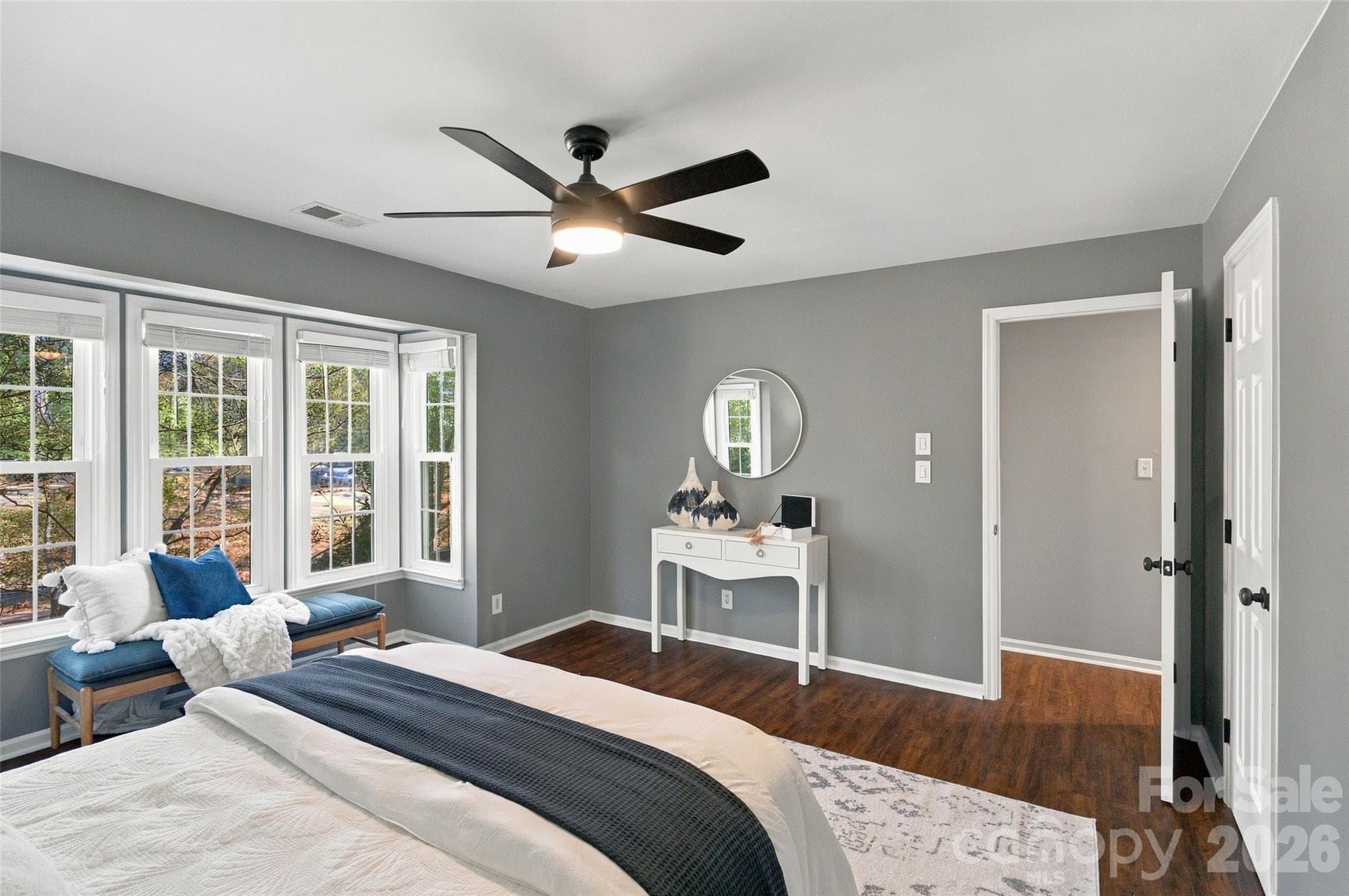 Spacious primary bedroom with ceiling fan and abundant natural light - 762 Marsh Road, Charlotte