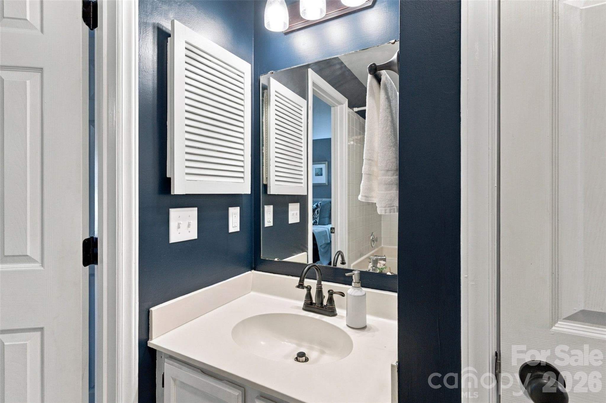 Additional vanity provides extra functionality in the primary bath - 762 Marsh Road, Charlotte