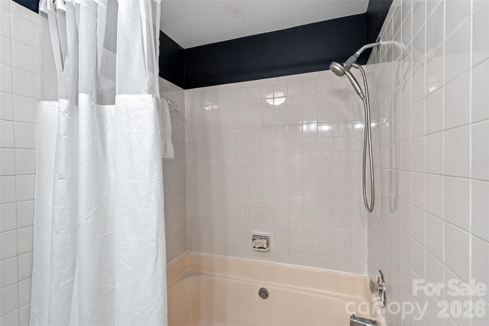 Tub/shower combination in the primary bath - 762 Marsh Road, Charlotte