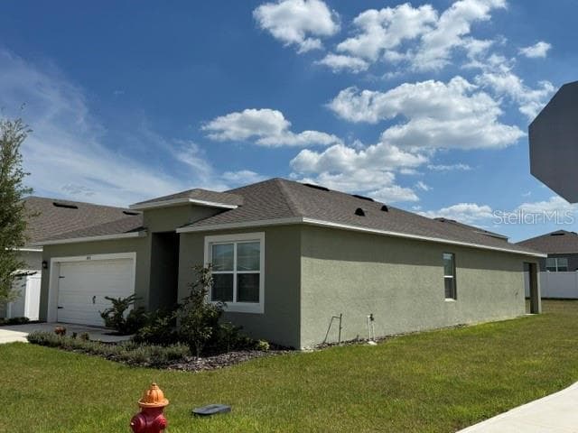 Front/side Elevation- Looking SE. - 3818 DIVING DOVE LN, BARTOW