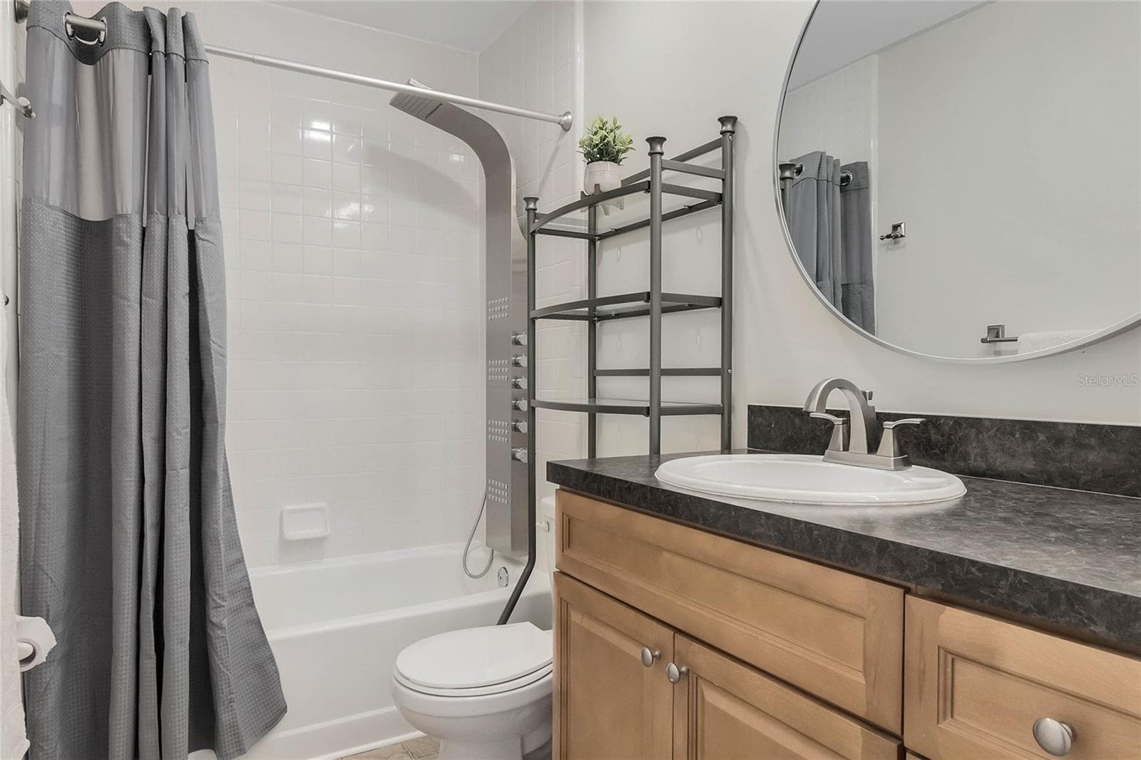 Secondary bathroom upstairs with updated shower head - 8235 AMBROSE COVE WAY, ORLANDO