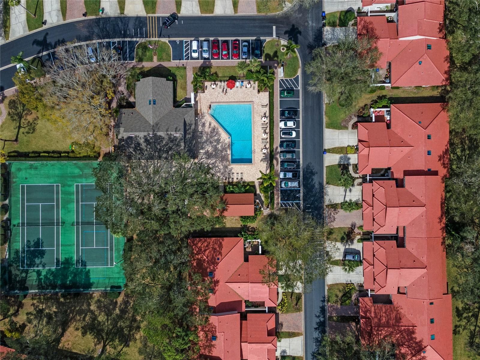 Community recreation areas with tennis courts and space for outdoor games. - 8235 AMBROSE COVE WAY, ORLANDO