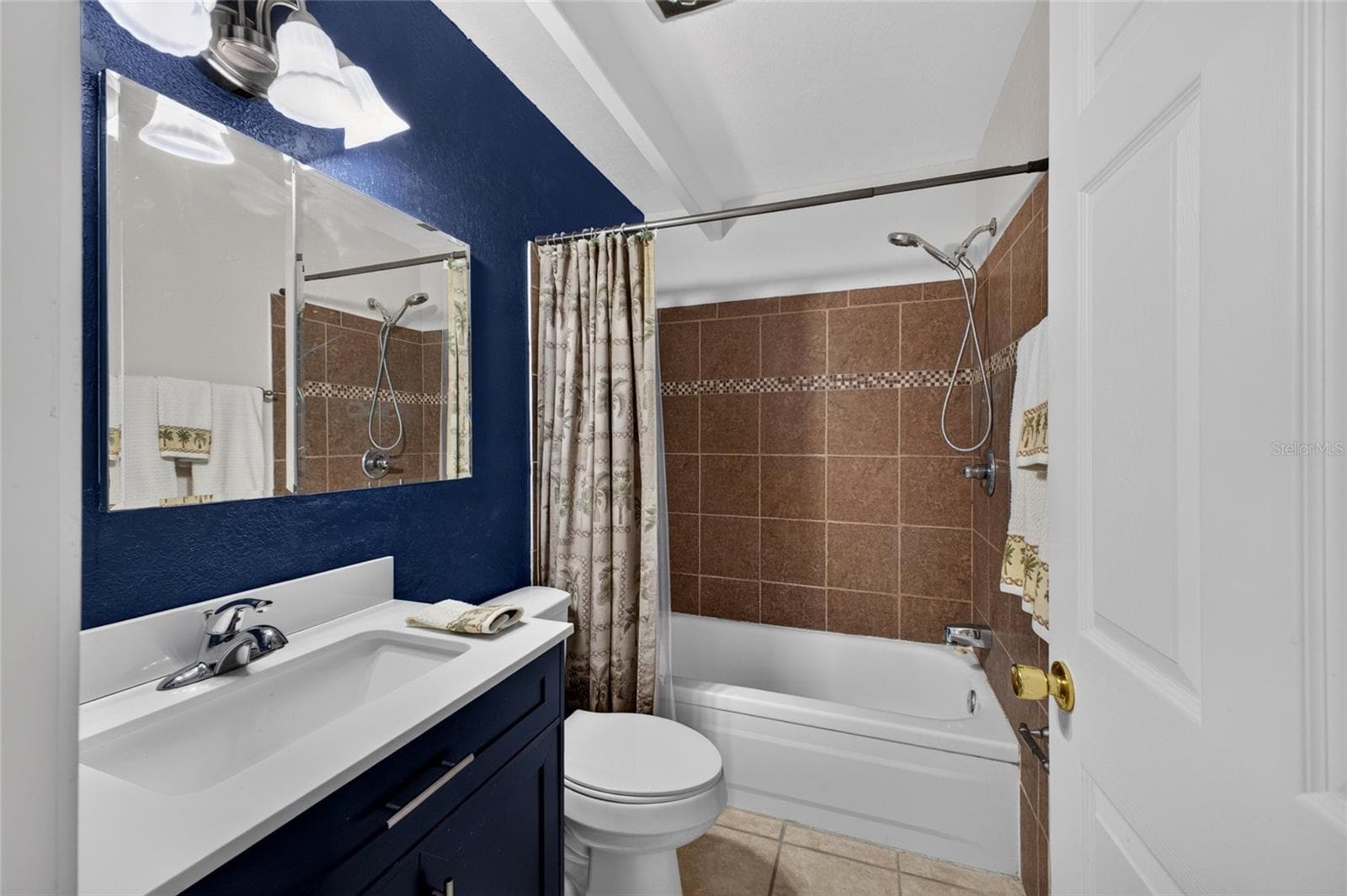 The bathroom has a new cabinet/sink/faucet/toilet and tile. - 4409 CLUB CIR, LAKE WALES