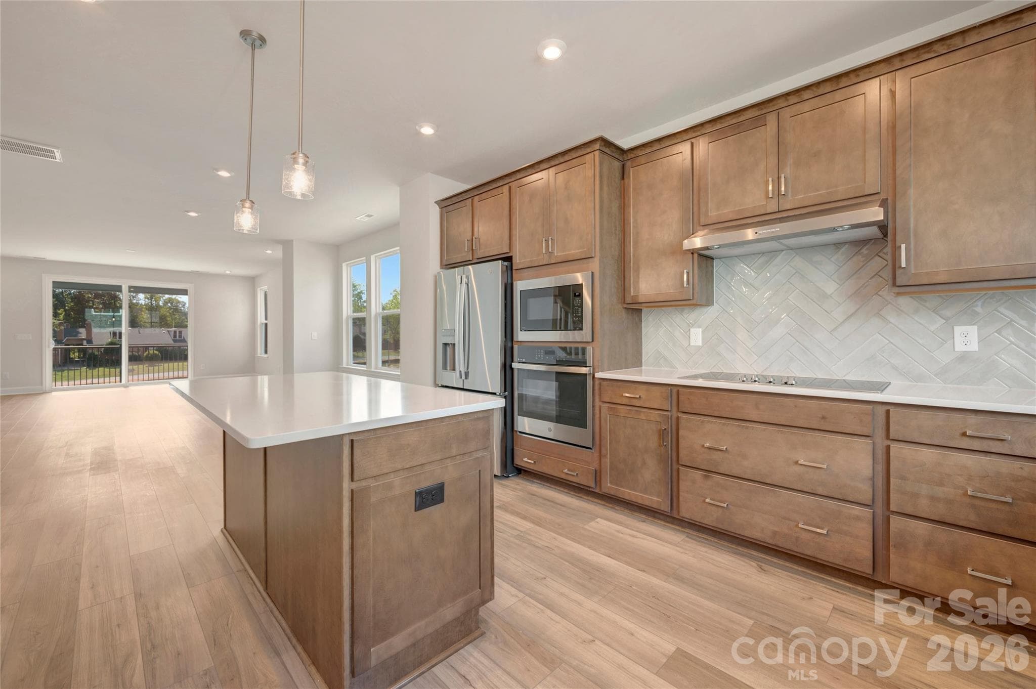Electric cooktop and ample storage in the gourmet kitchen - Charlotte