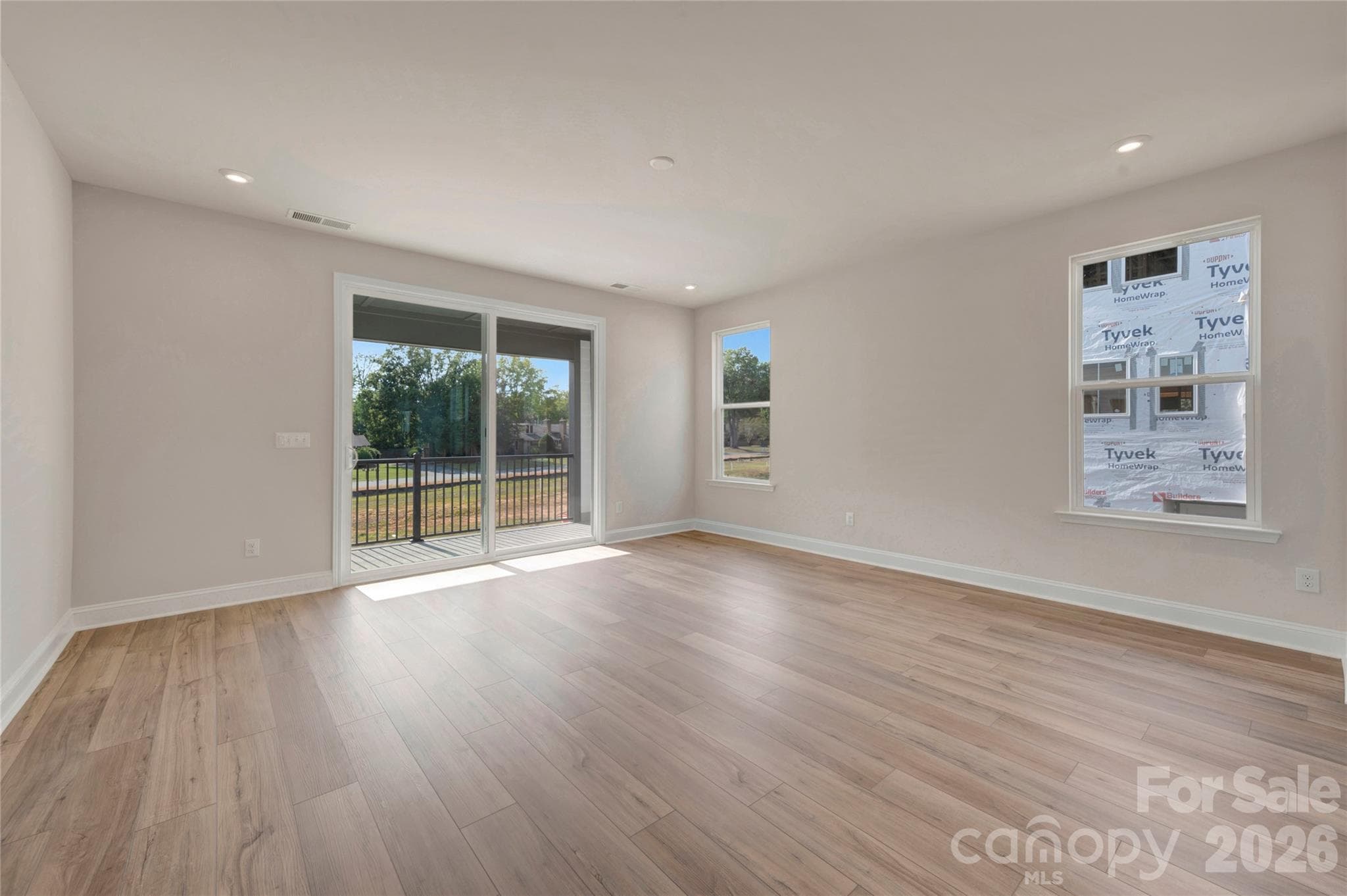 Living room with access to the covered outdoor living space - Charlotte