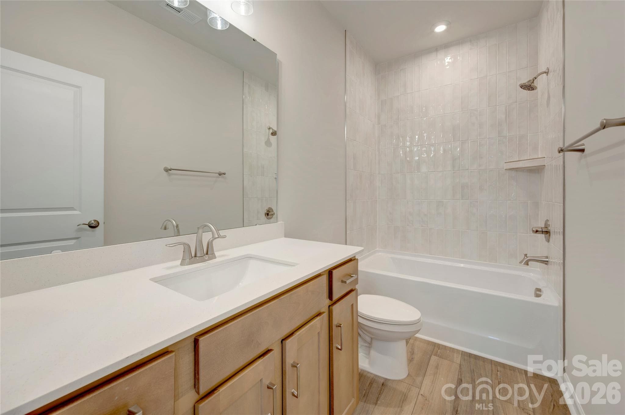 Secondary bathroom with tiled walls above the tub - Charlotte